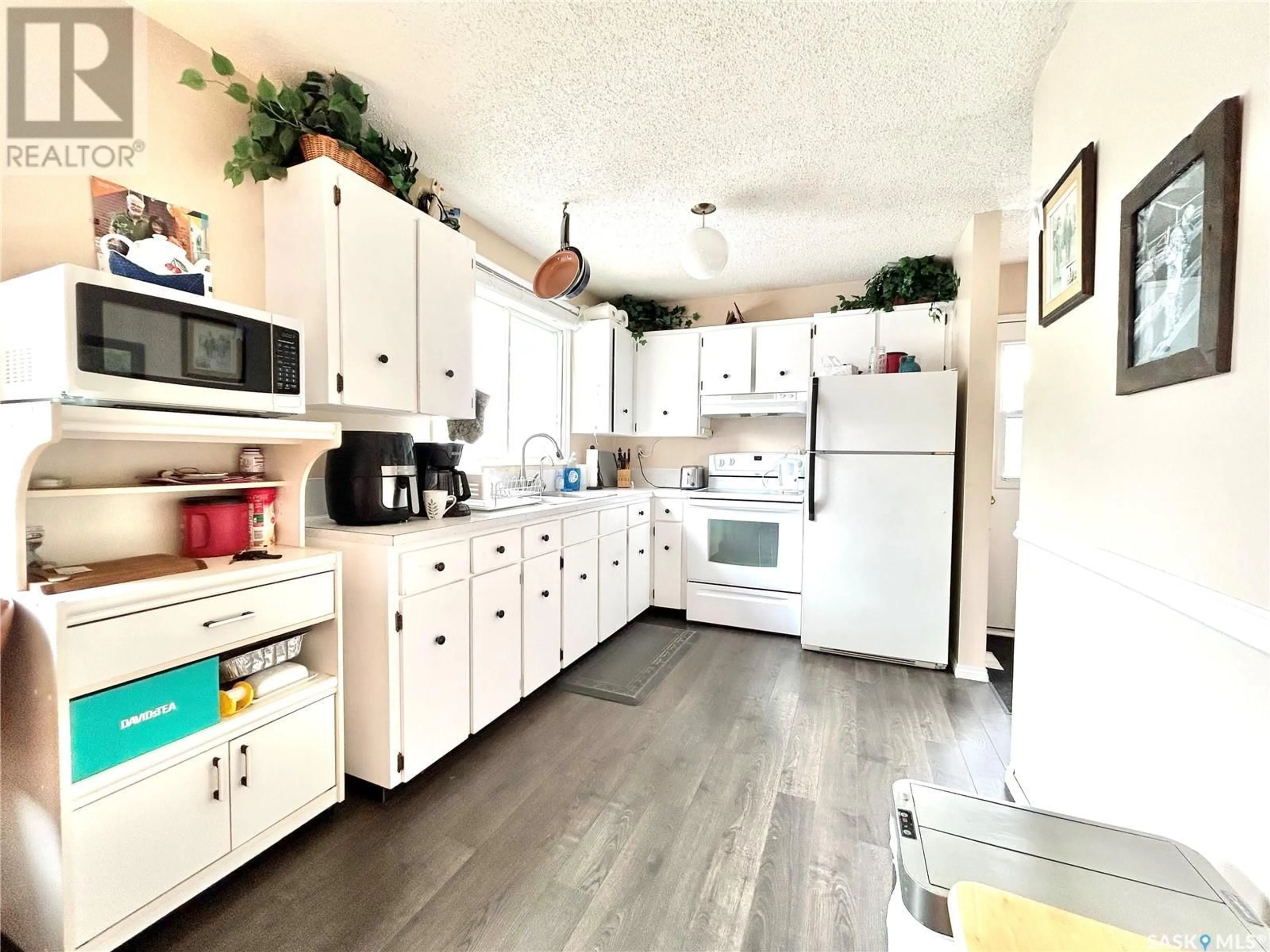Open concept kitchen, wood/laminate floor for 22 MATHESON CRESCENT, Yorkton Saskatchewan S3N3M3