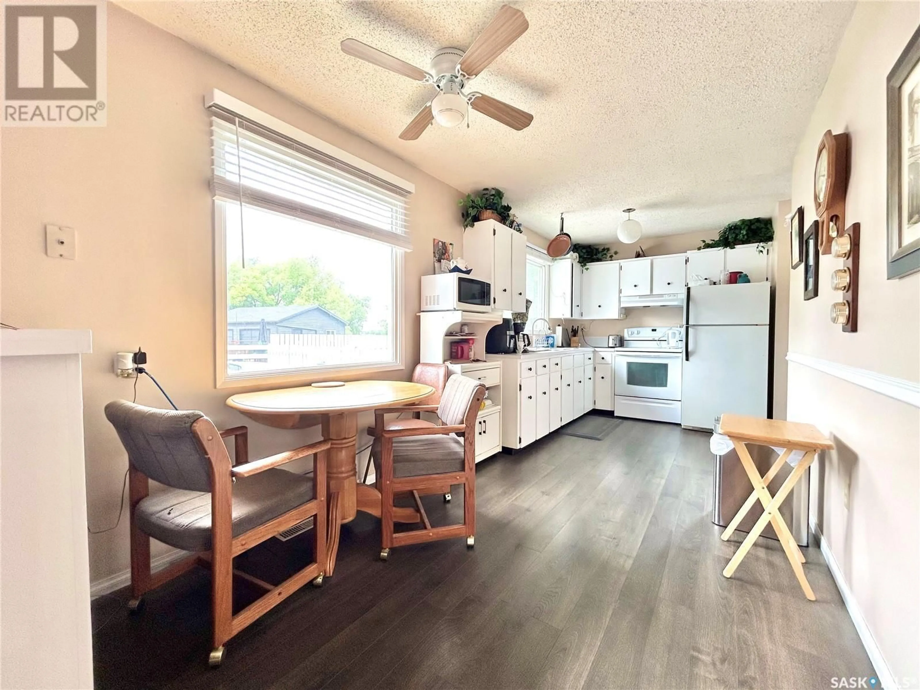 Open concept kitchen, wood/laminate floor for 22 MATHESON CRESCENT, Yorkton Saskatchewan S3N3M3