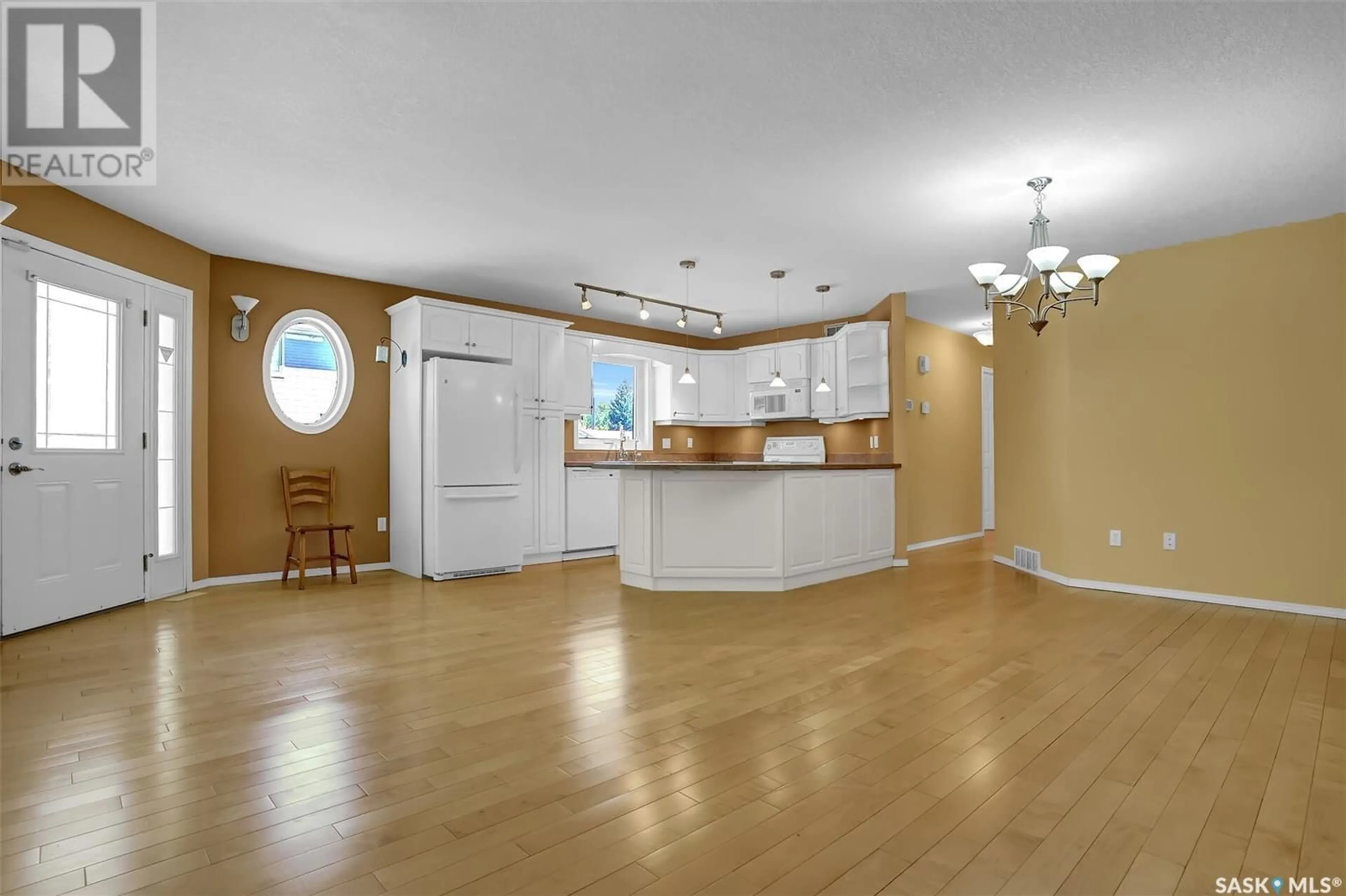 Open concept kitchen, wood/laminate floor for 2701 MCDONALD STREET, Regina Saskatchewan S4N2Z9