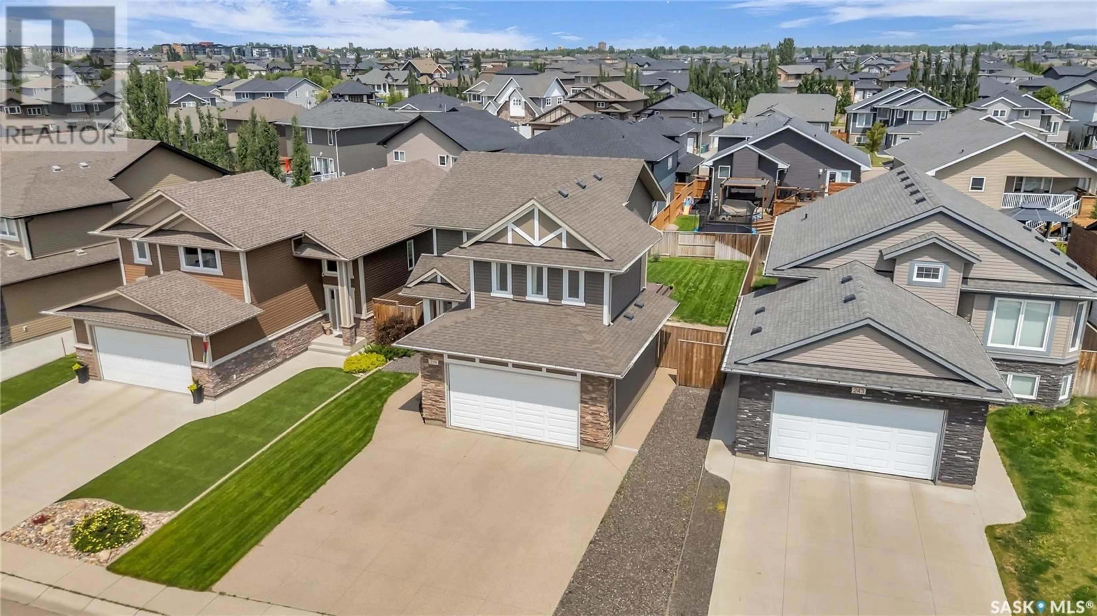 A pic from outside/outdoor area/front of a property/back of a property/a pic from drone, street for 239 PRINGLE LANE, Saskatoon Saskatchewan S7T1C9