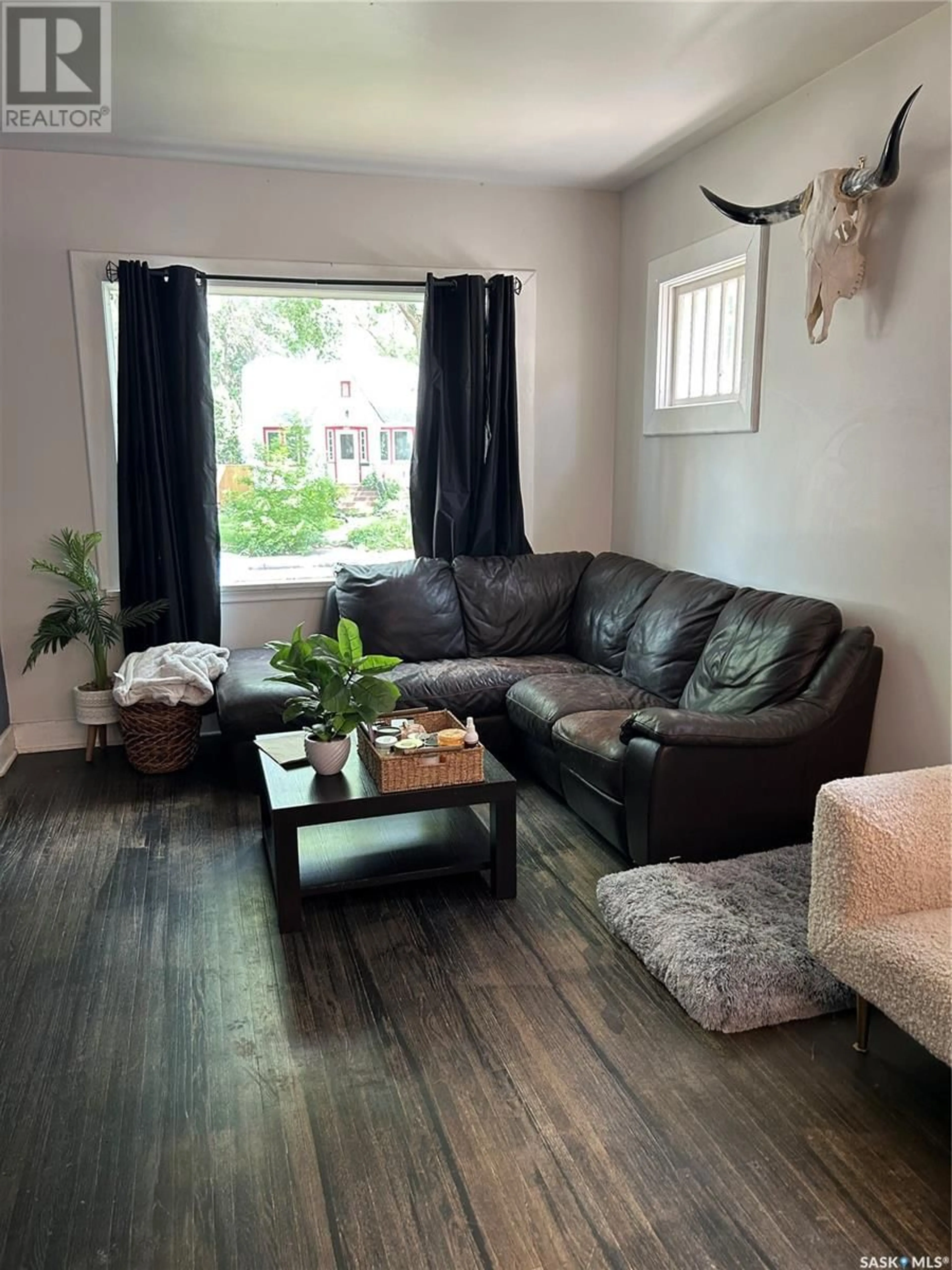 Living room with furniture, wood/laminate floor for 2664 WALLACE STREET, Regina Saskatchewan S4N4B6