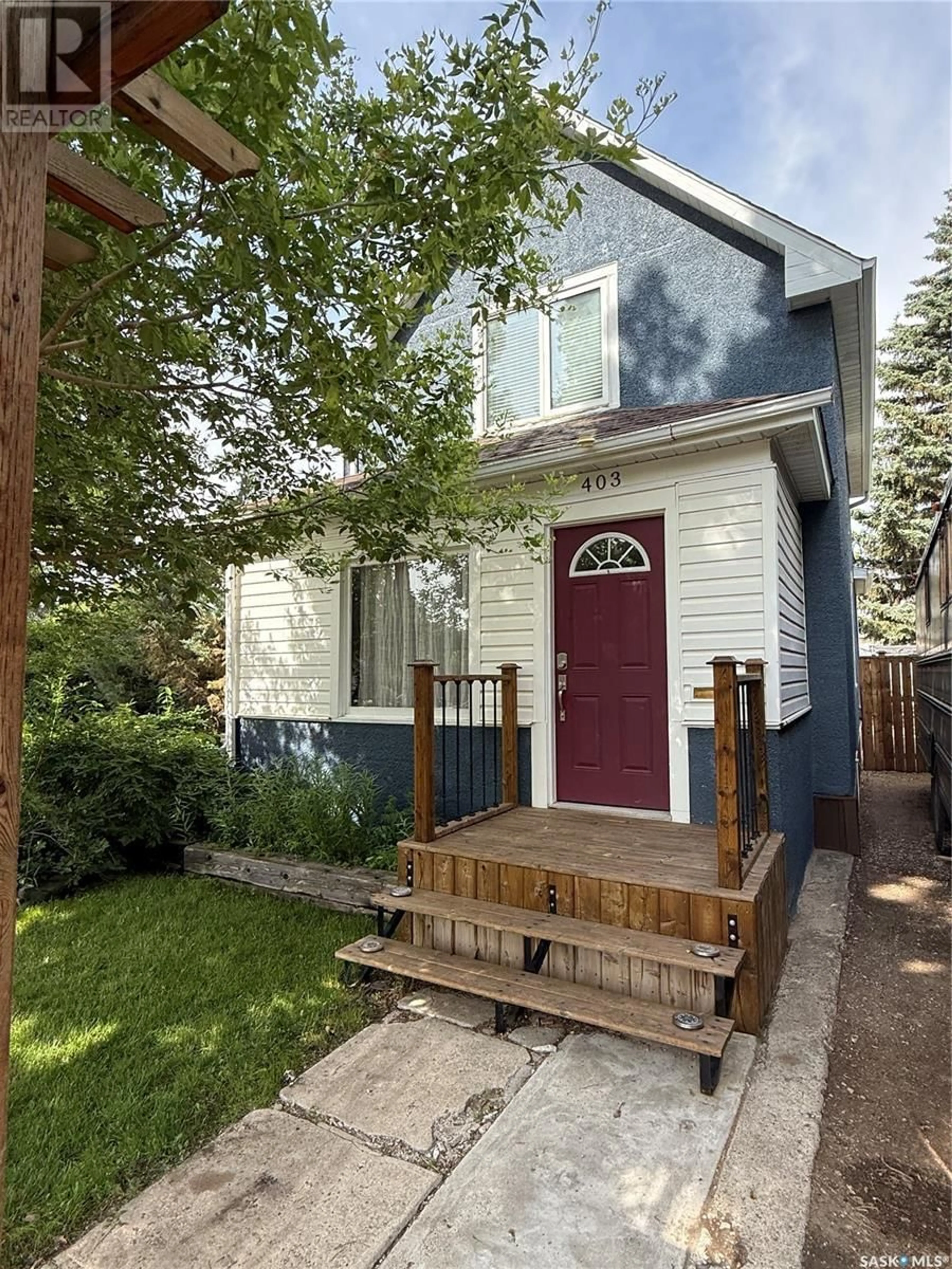 Home with vinyl exterior material, street for 403 QU'APPELLE STREET, Weyburn Saskatchewan S4H0R3