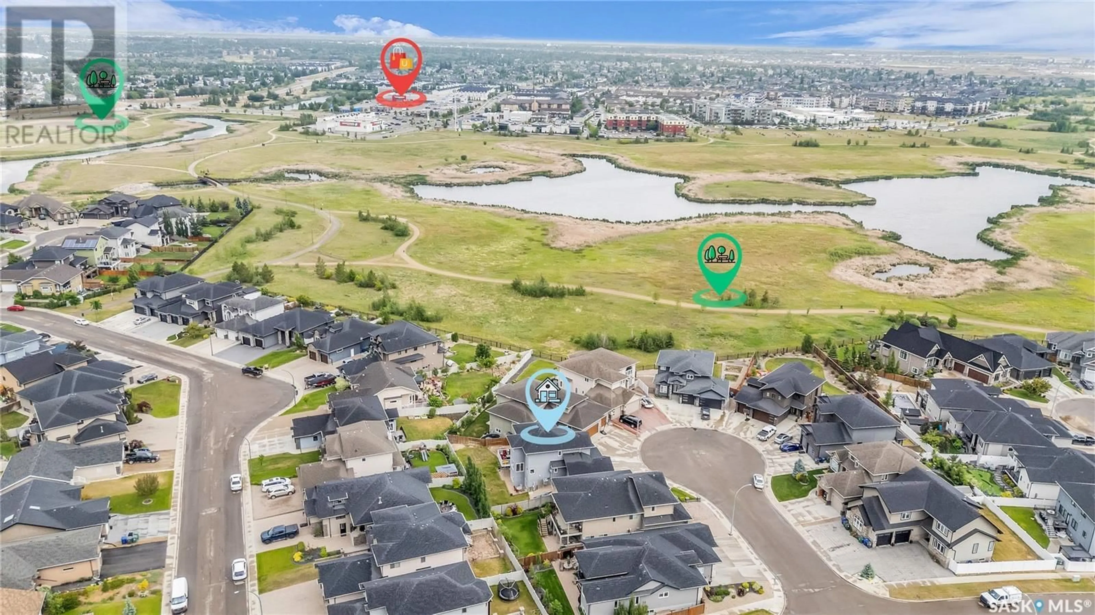 A pic from outside/outdoor area/front of a property/back of a property/a pic from drone, water/lake/river/ocean view for 131 ROCHELLE BAY, Saskatoon Saskatchewan S7V0H6