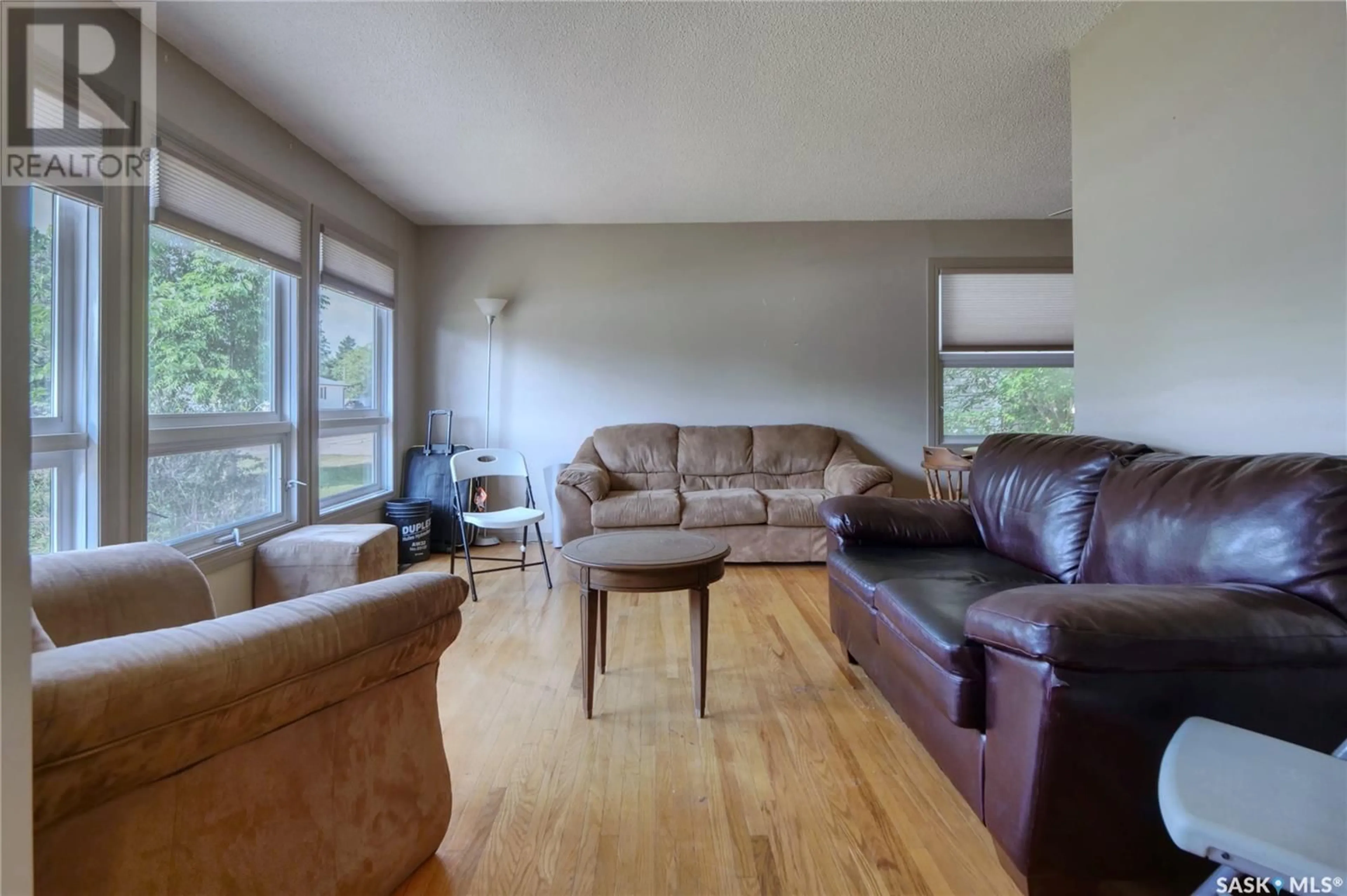 Living room with furniture, wood/laminate floor for 736 SASKATCHEWAN STREET, Moose Jaw Saskatchewan S6H2T7