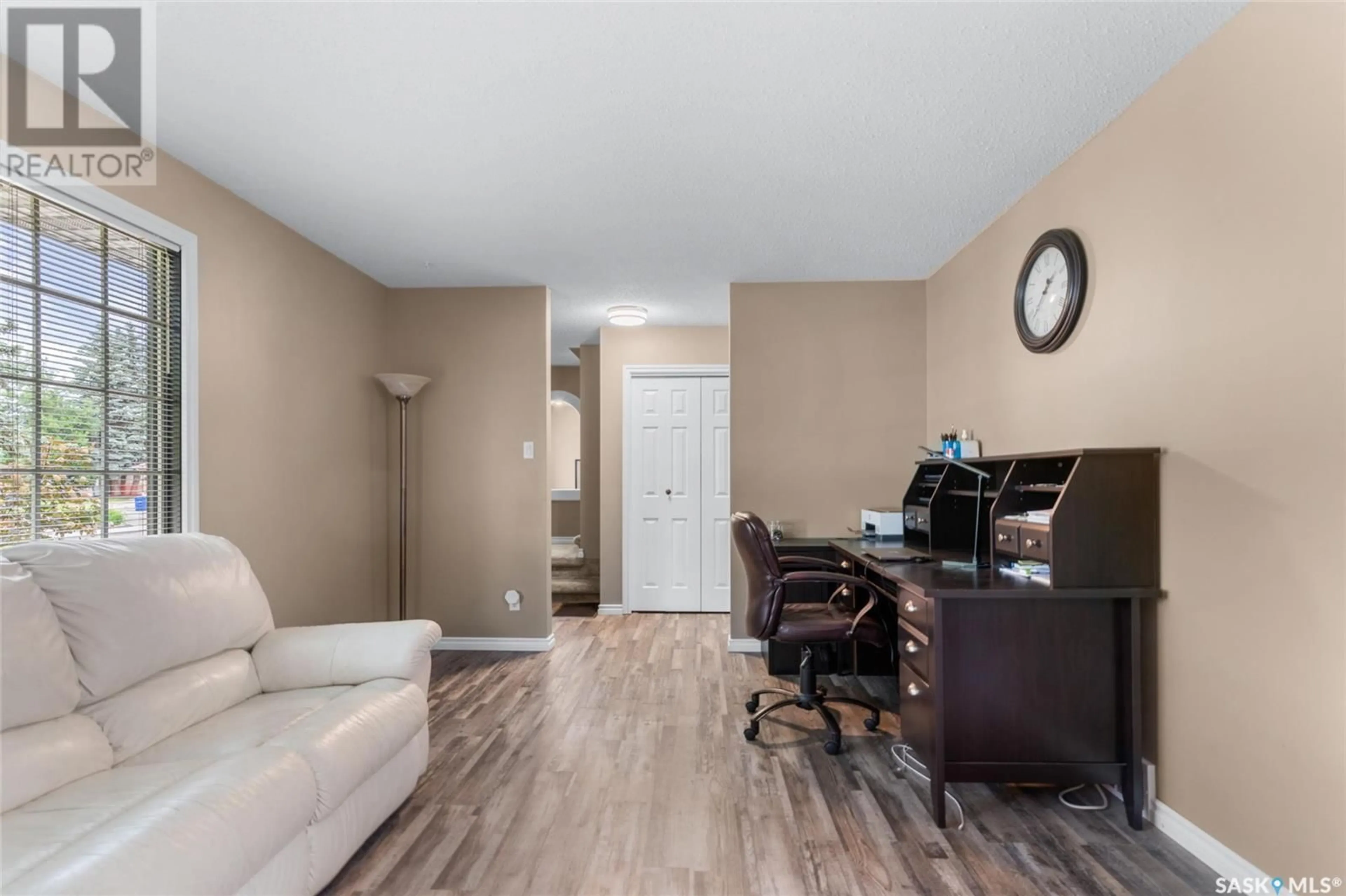 Living room with furniture, wood/laminate floor for 538 TRENT CRESCENT, Saskatoon Saskatchewan S7H4T1