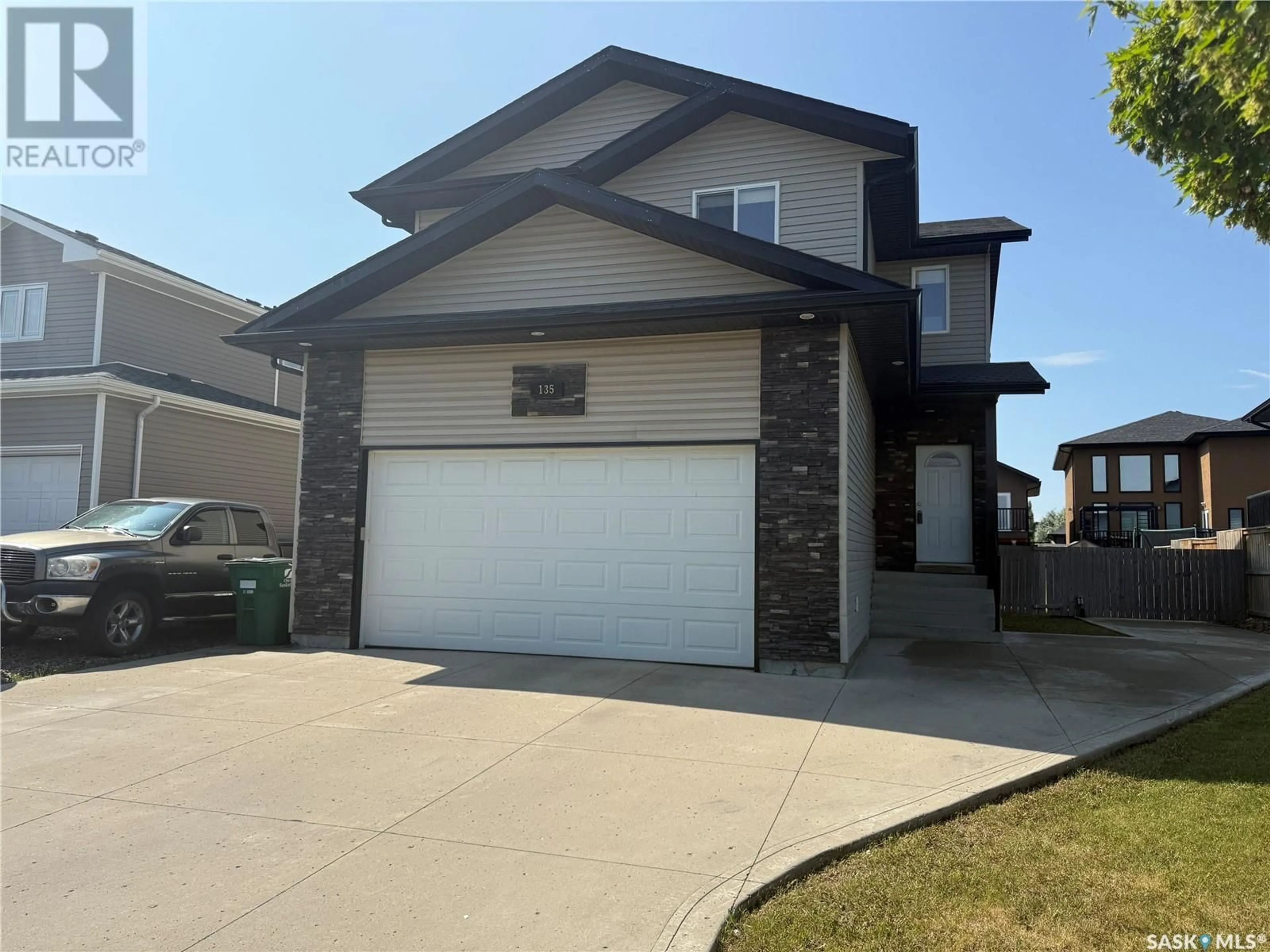 Home with vinyl exterior material, street for 135 WEST HAMPTON BOULEVARD, Saskatoon Saskatchewan S7R0B7