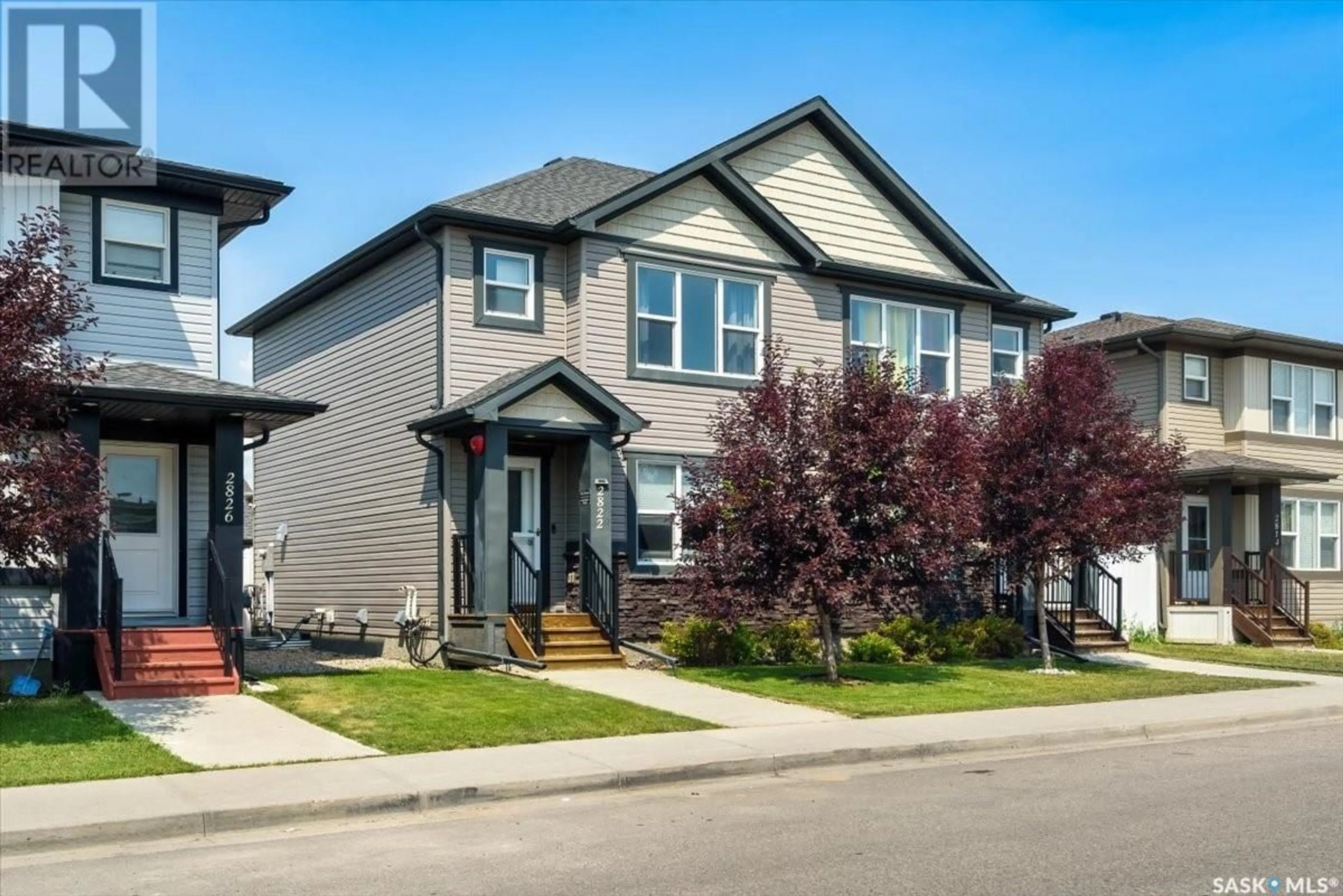 Home with vinyl exterior material, street for 2822 ROCHDALE BOULEVARD, Regina Saskatchewan S4X0M6