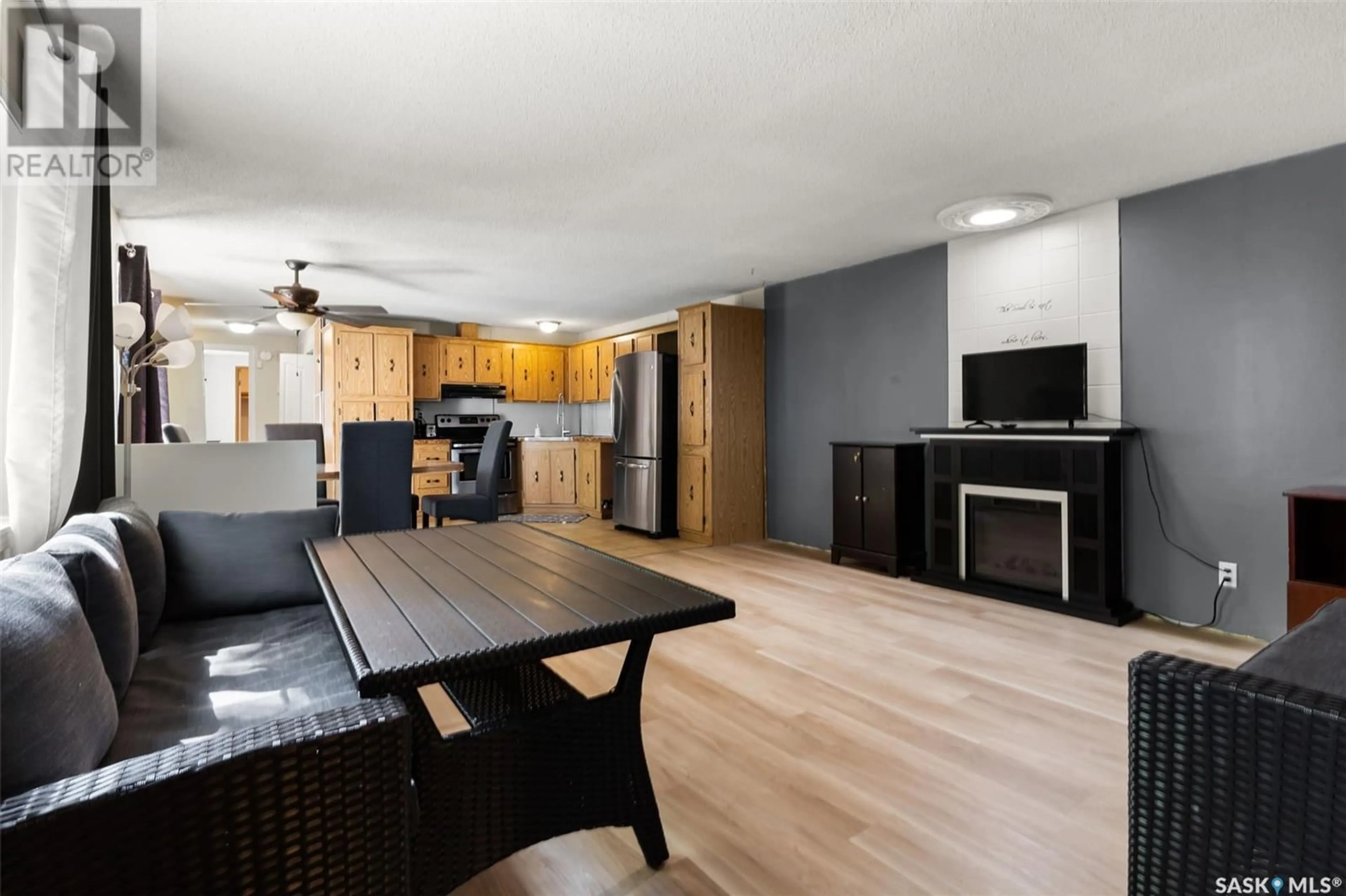 Open concept kitchen, wood/laminate floor for 104 DONOVEL CRESCENT, Regina Beach Saskatchewan S0G4C0