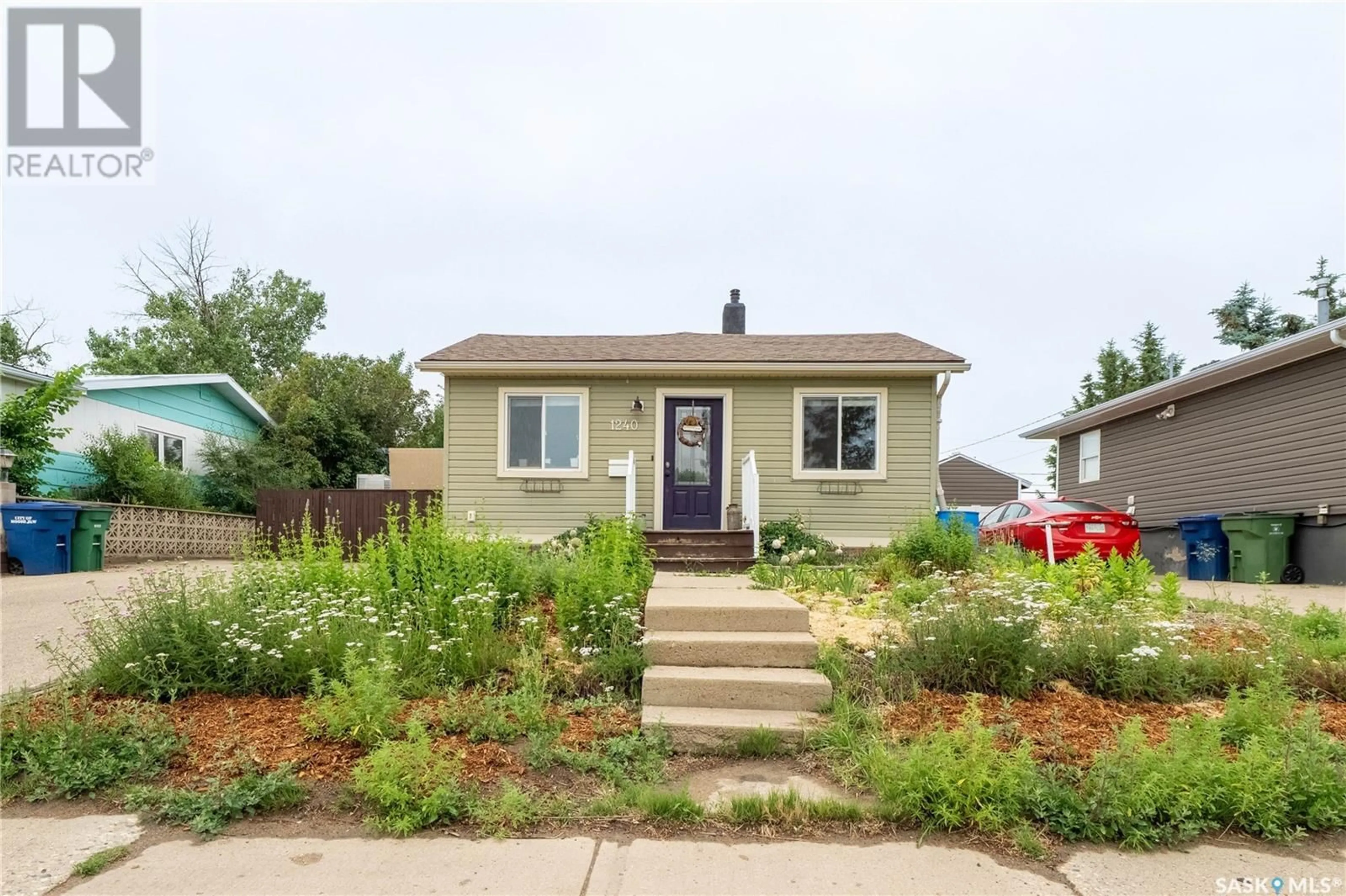 Home with vinyl exterior material, street for 1240 COTEAU STREET, Moose Jaw Saskatchewan S6H5G8