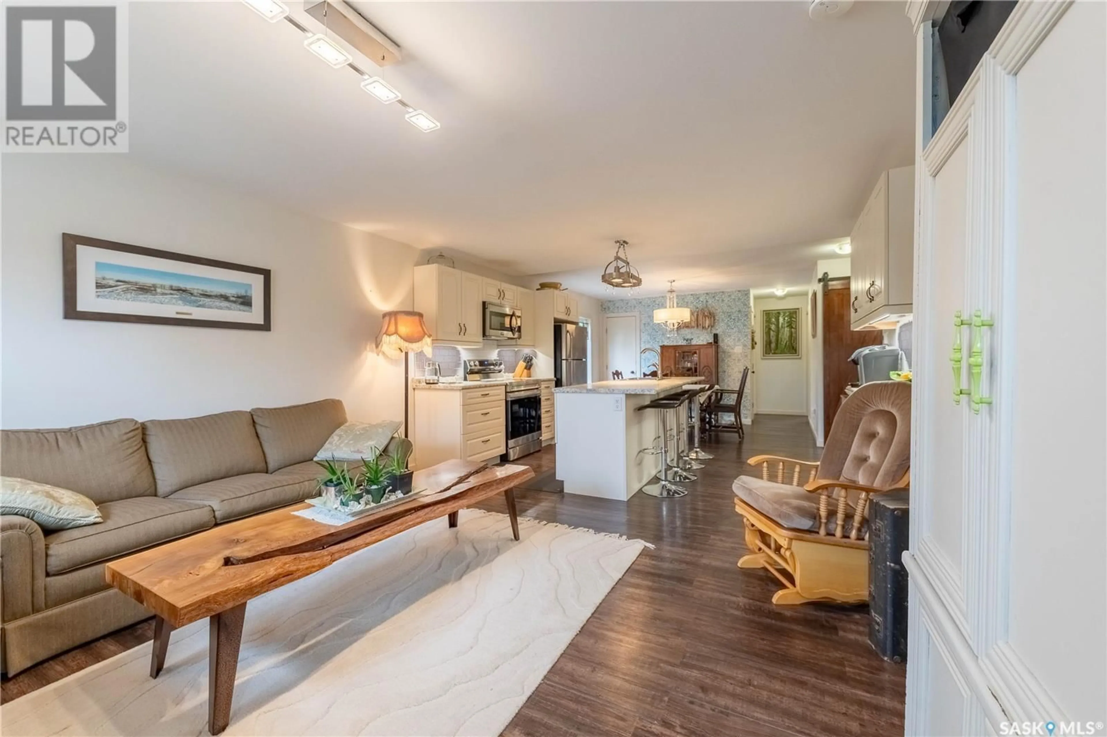 Living room with furniture, wood/laminate floor for 1240 COTEAU STREET, Moose Jaw Saskatchewan S6H5G8