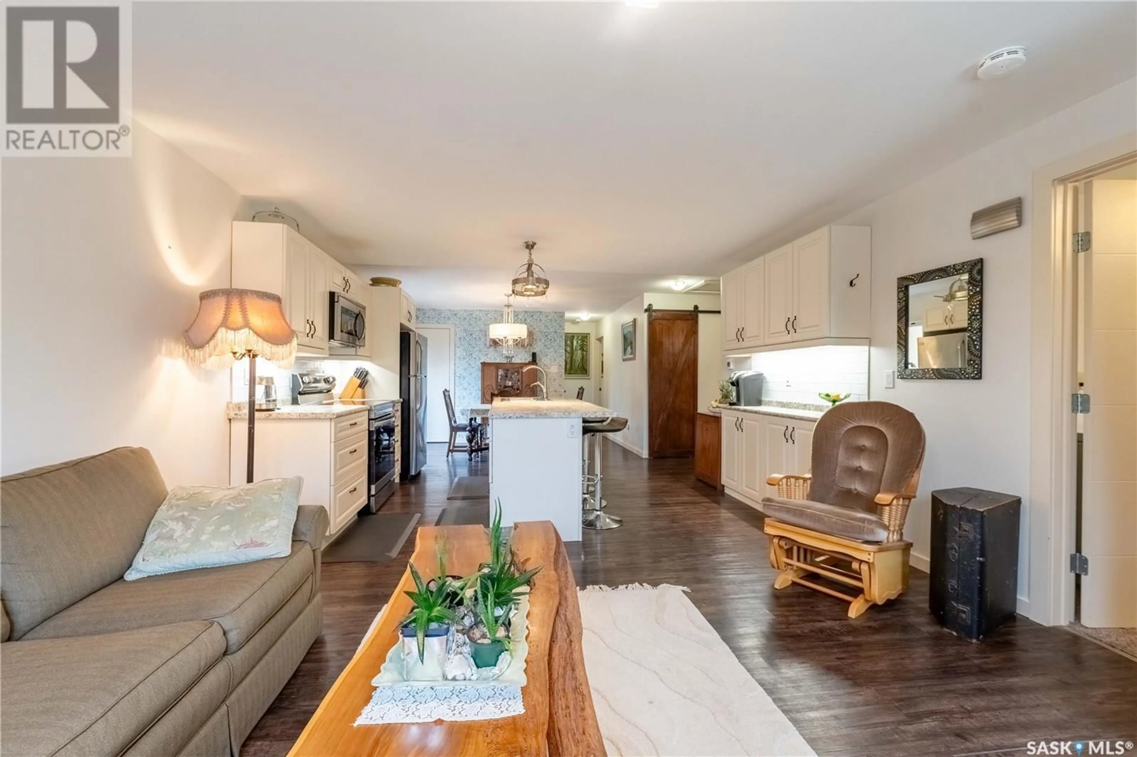 Open concept kitchen, wood/laminate floor for 1240 COTEAU STREET, Moose Jaw Saskatchewan S6H5G8