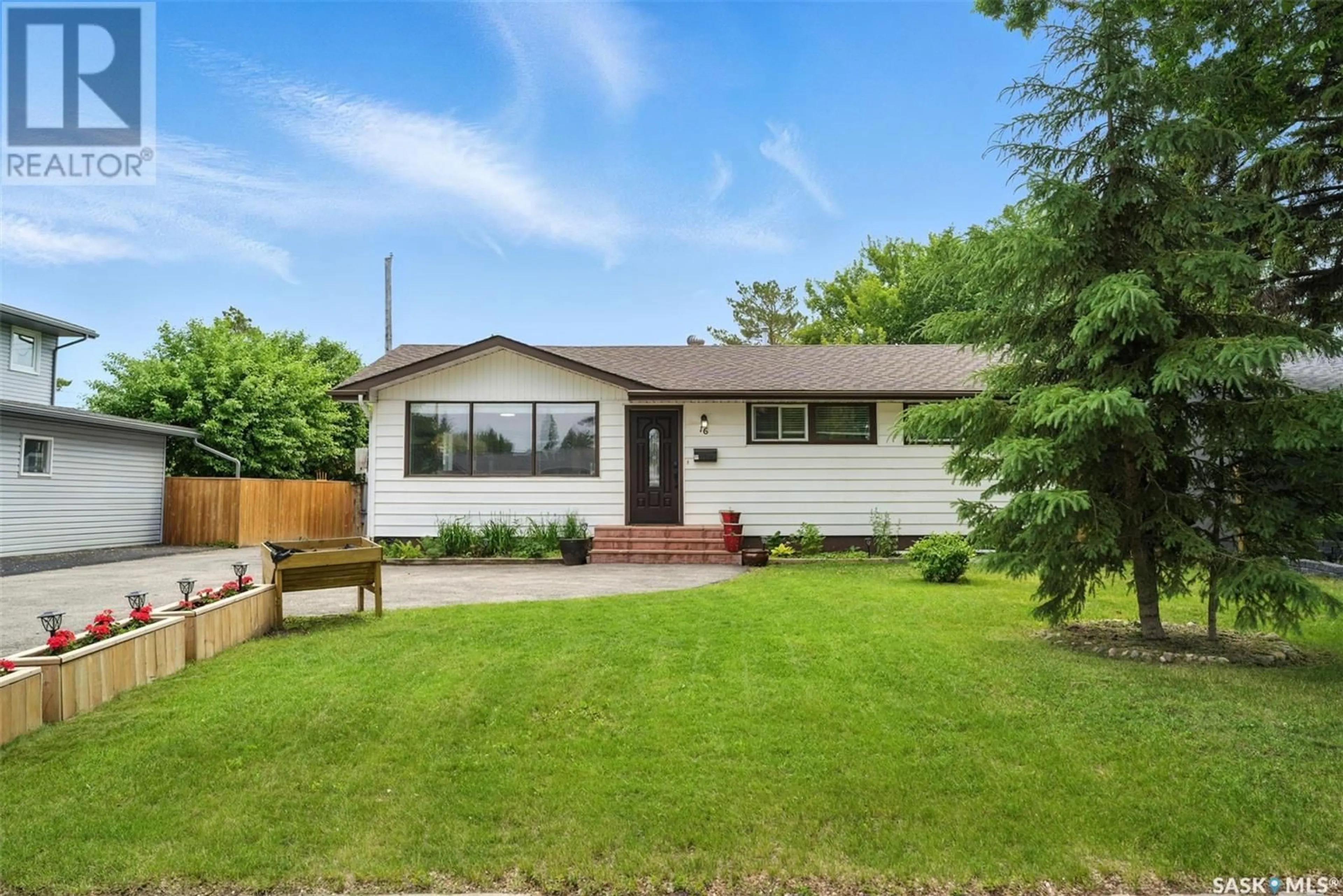 Home with vinyl exterior material, street for 16 LINDSAY DRIVE, Saskatoon Saskatchewan S7H3E1