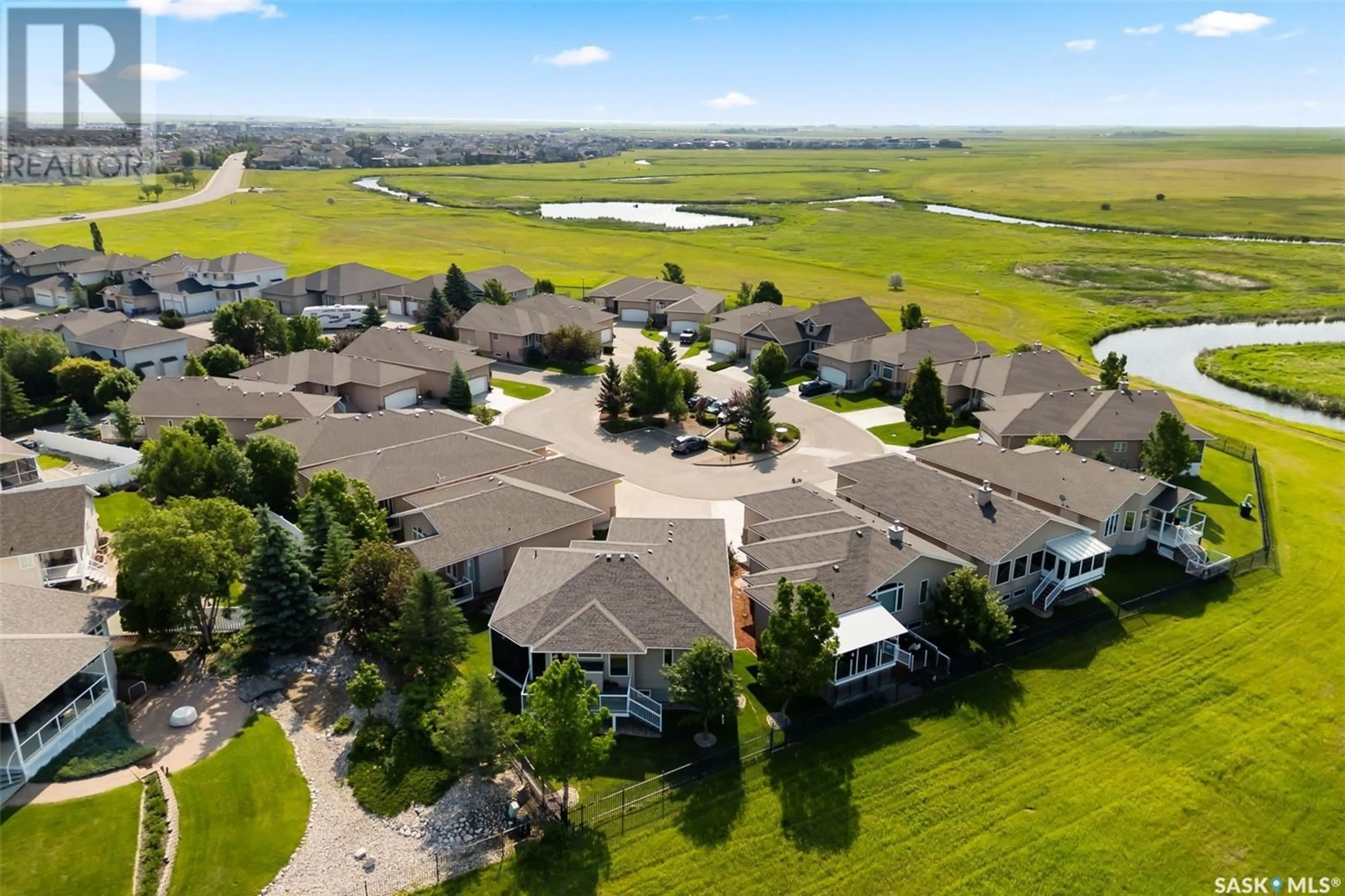 A pic from outside/outdoor area/front of a property/back of a property/a pic from drone, water/lake/river/ocean view for 10166 WASCANA ESTATES, Regina Saskatchewan S4V3E5