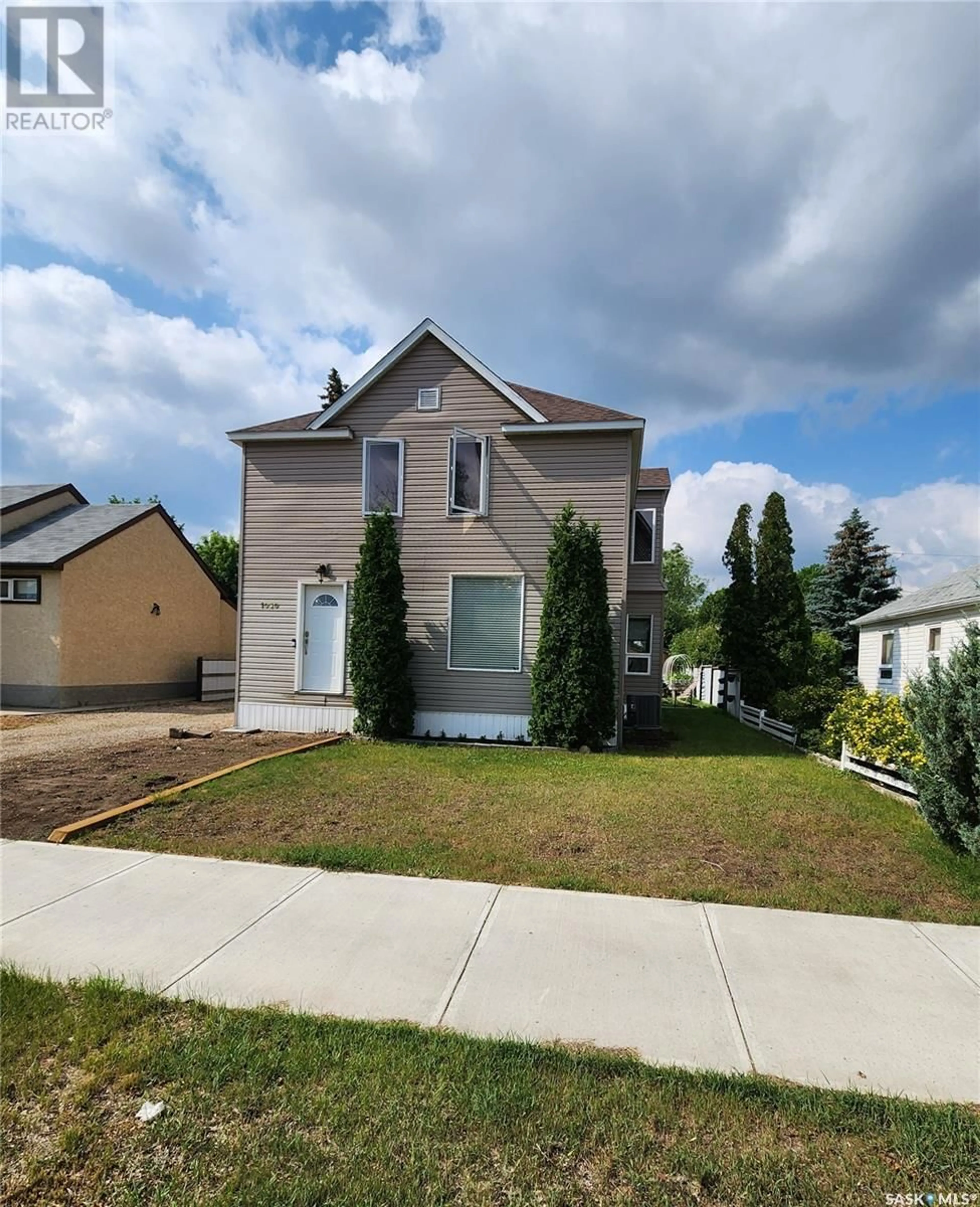 Home with vinyl exterior material, street for 1030 3RD STREET, Estevan Saskatchewan S4A0R5