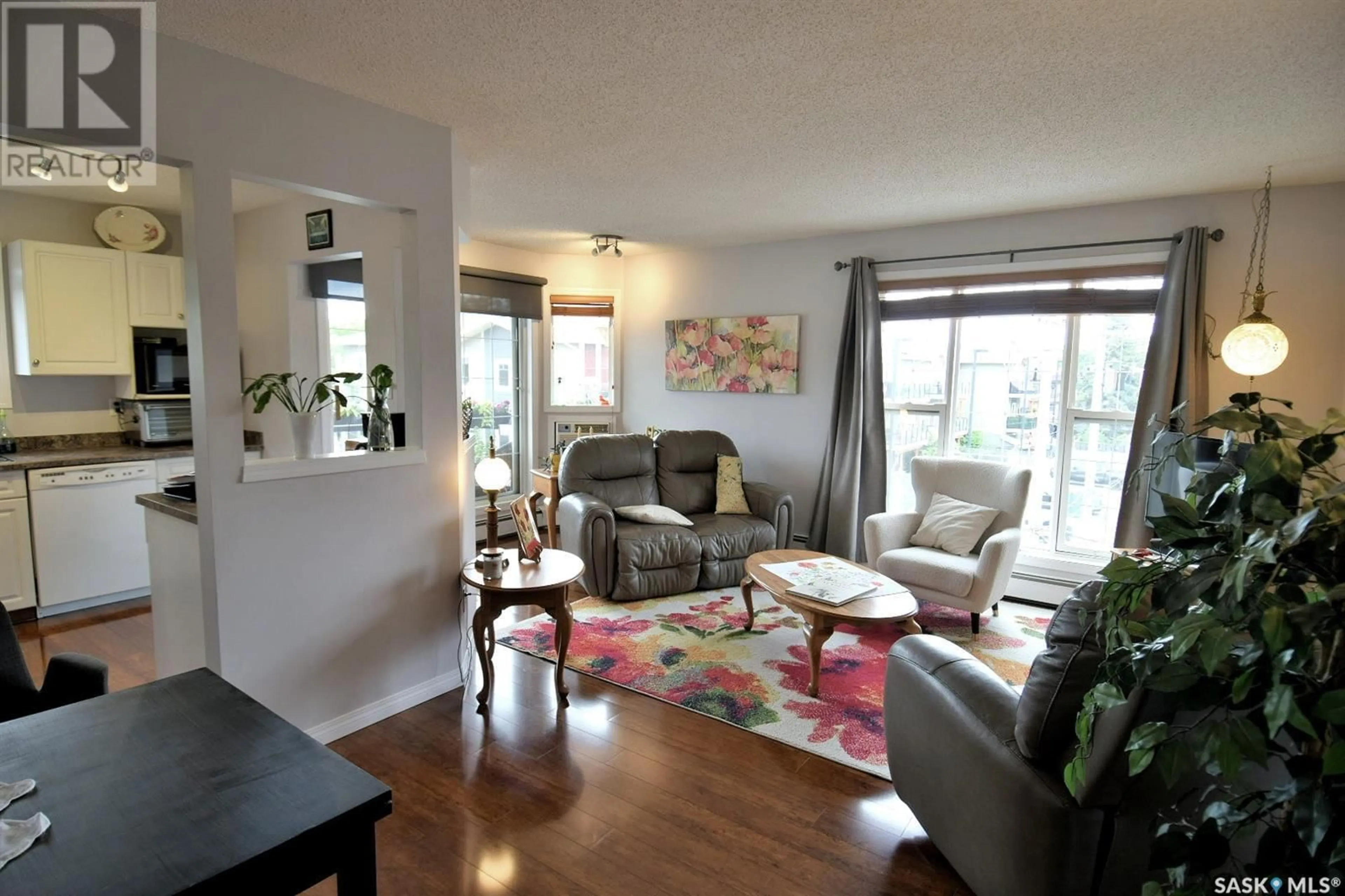 Living room with furniture, wood/laminate floor for 304 - 1012 LANSDOWNE AVENUE, Saskatoon Saskatchewan S7H2C3