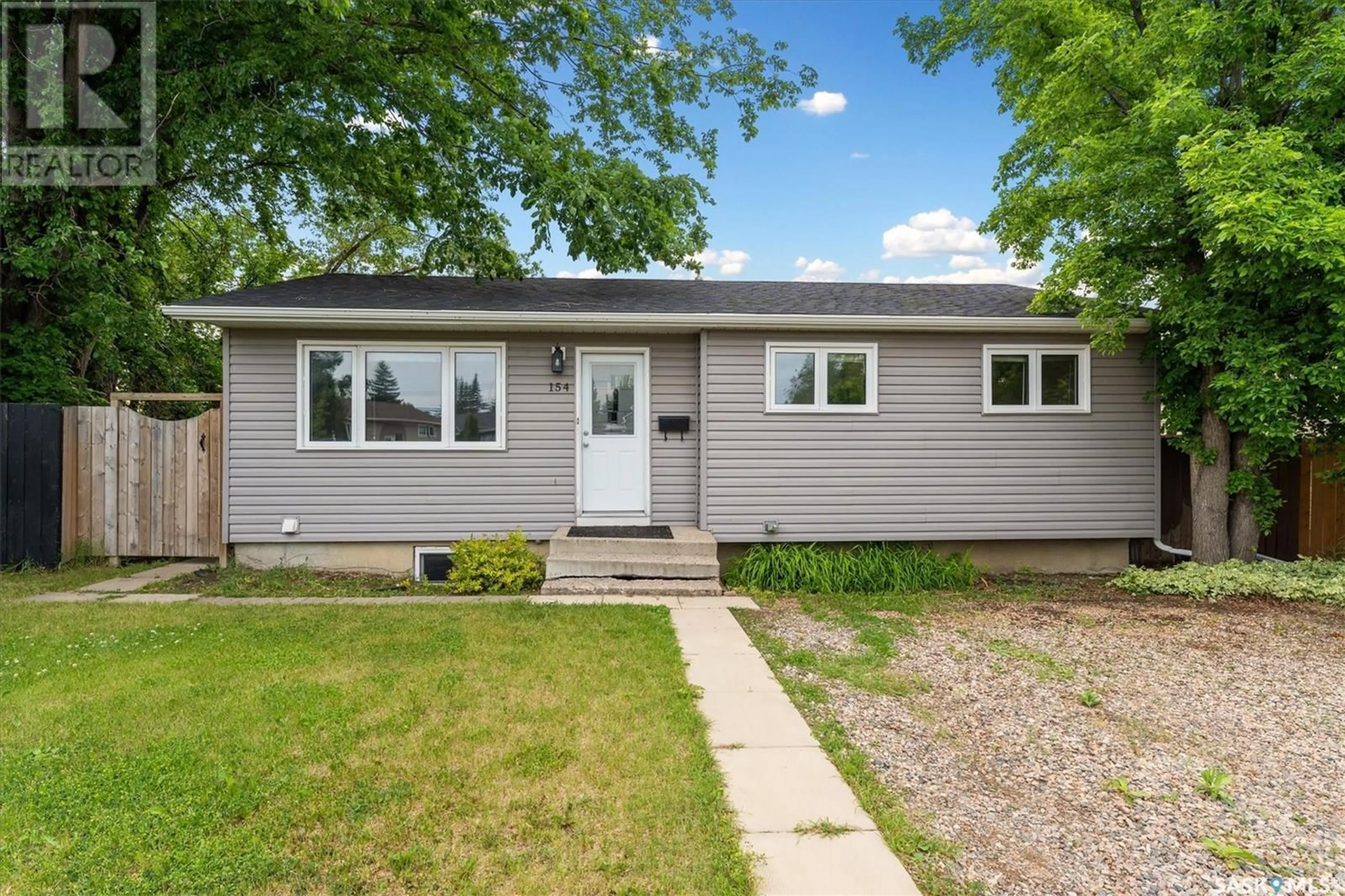 Home with vinyl exterior material, street for 154 SPINKS DRIVE, Saskatoon Saskatchewan S7H4G7