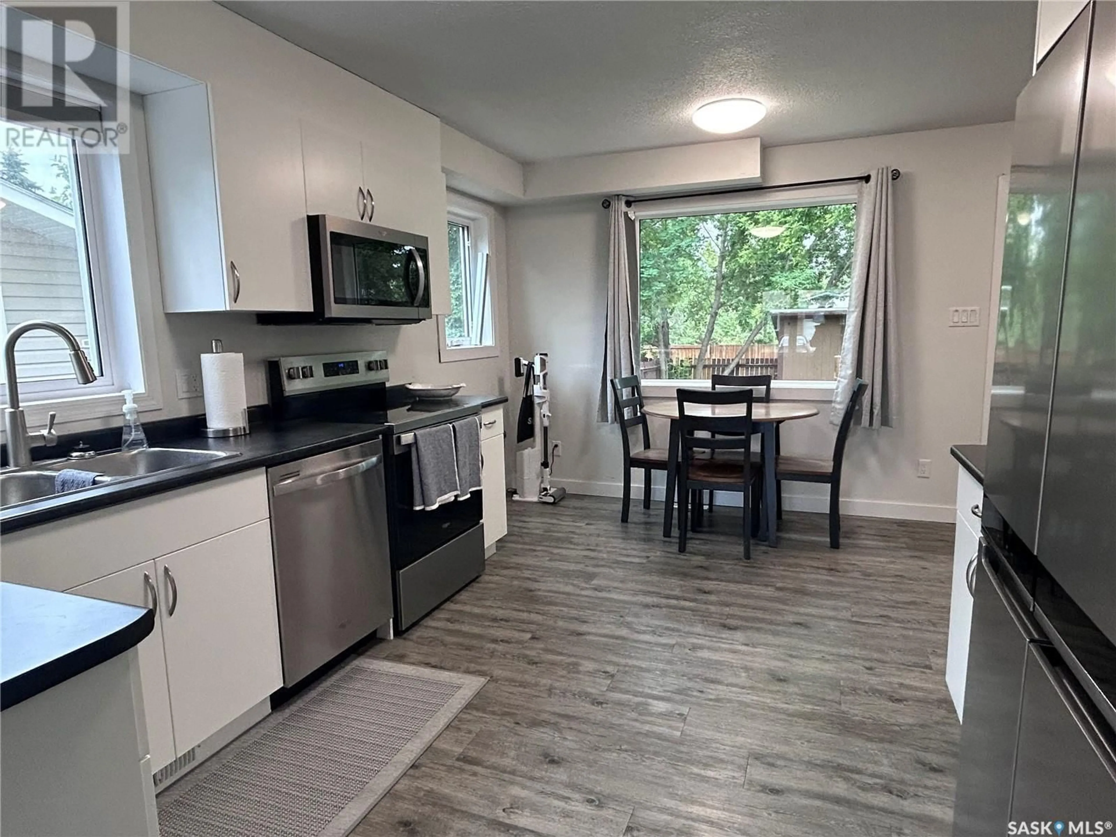 Open concept kitchen, wood/laminate floor for 11357 CLARK DRIVE, North Battleford Saskatchewan S9A3P6