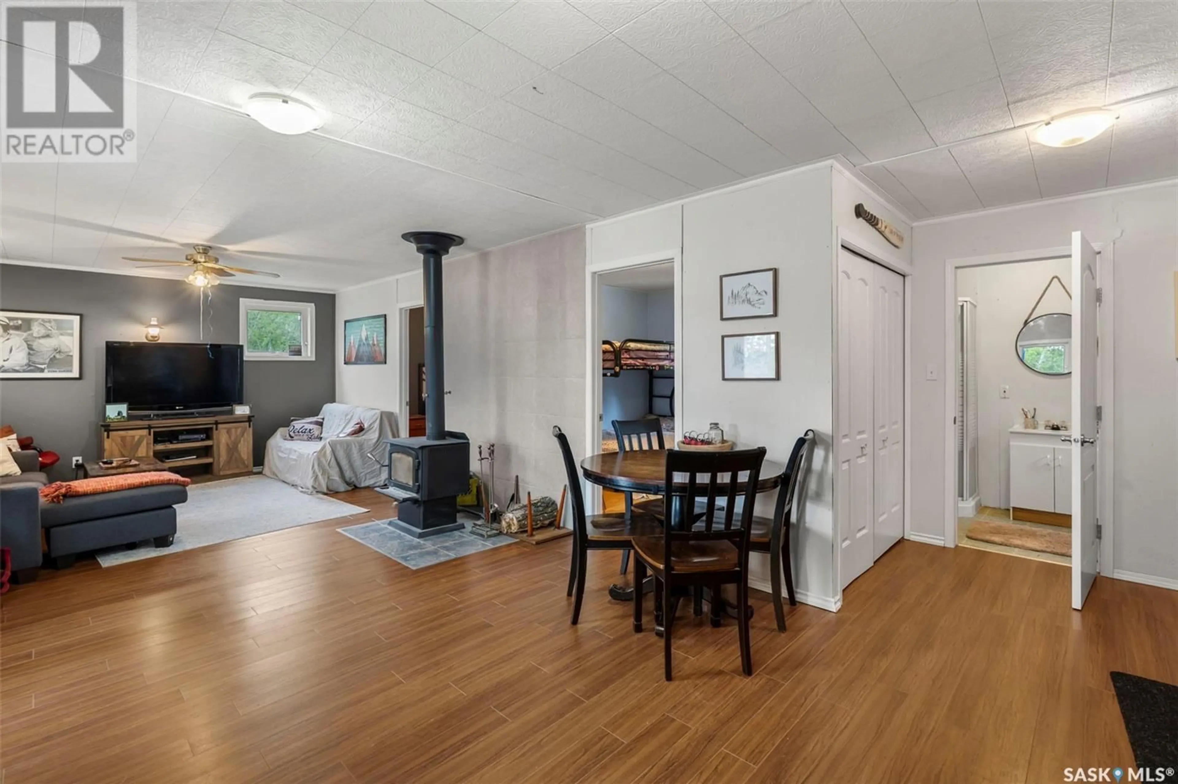 Living room with furniture, wood/laminate floor for Lot 9 Block 1 - 9 RHONA LAKE, Rhona Lake Saskatchewan S0K4X0