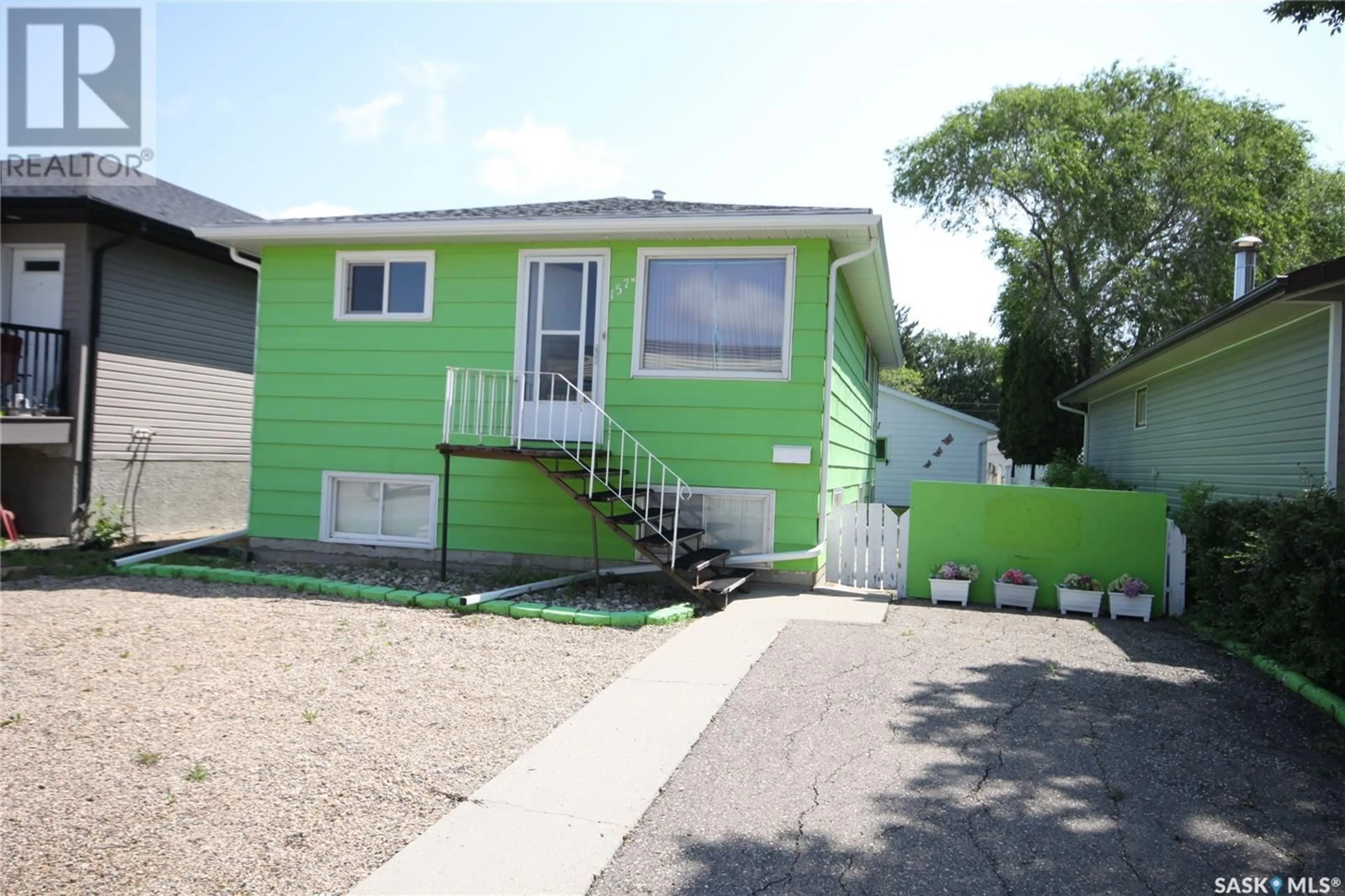 Home with vinyl exterior material, street for 157 MCINTYRE STREET, Regina Saskatchewan S4R3B6