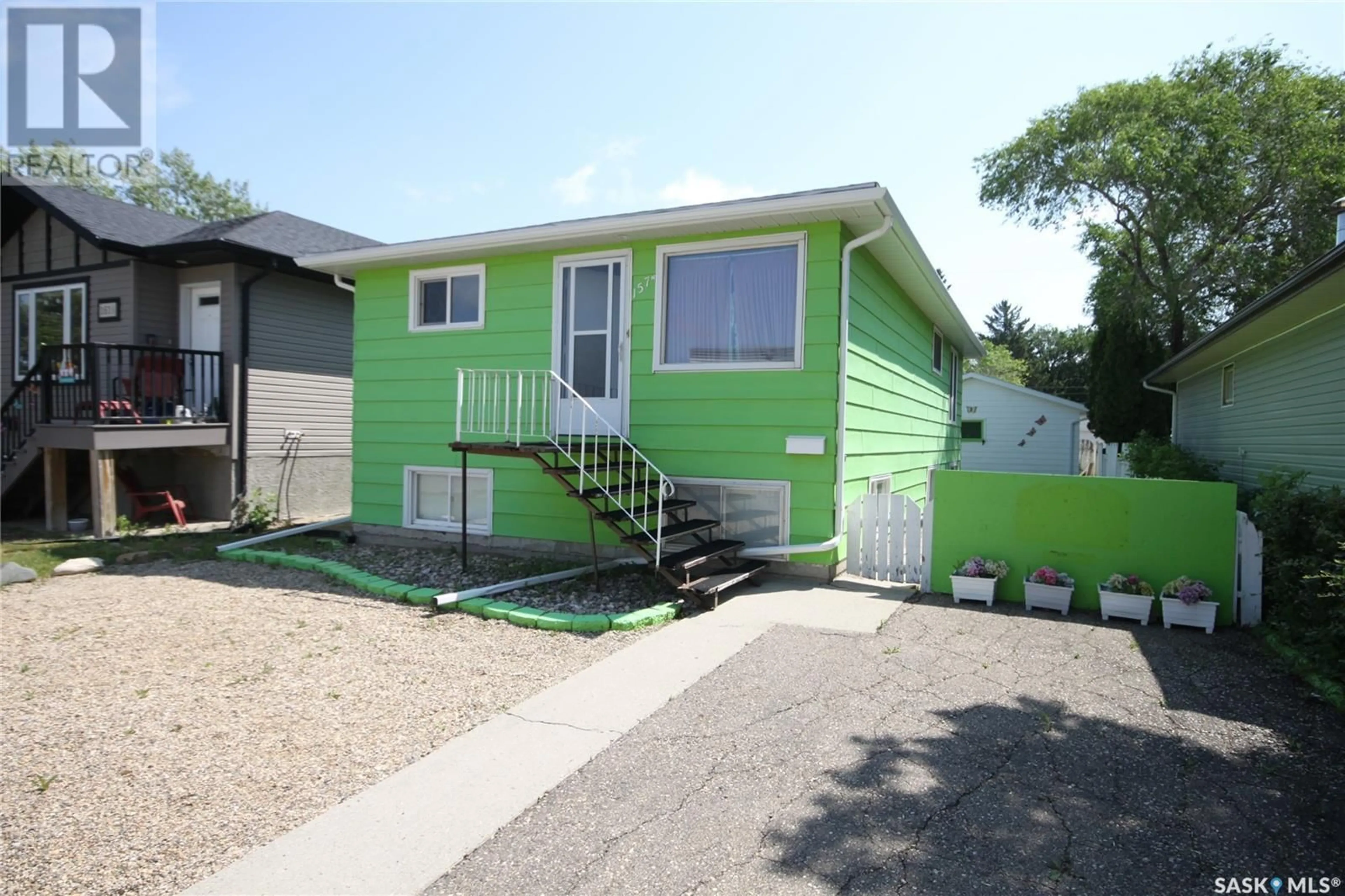 Home with vinyl exterior material, street for 157 MCINTYRE STREET, Regina Saskatchewan S4R3B6