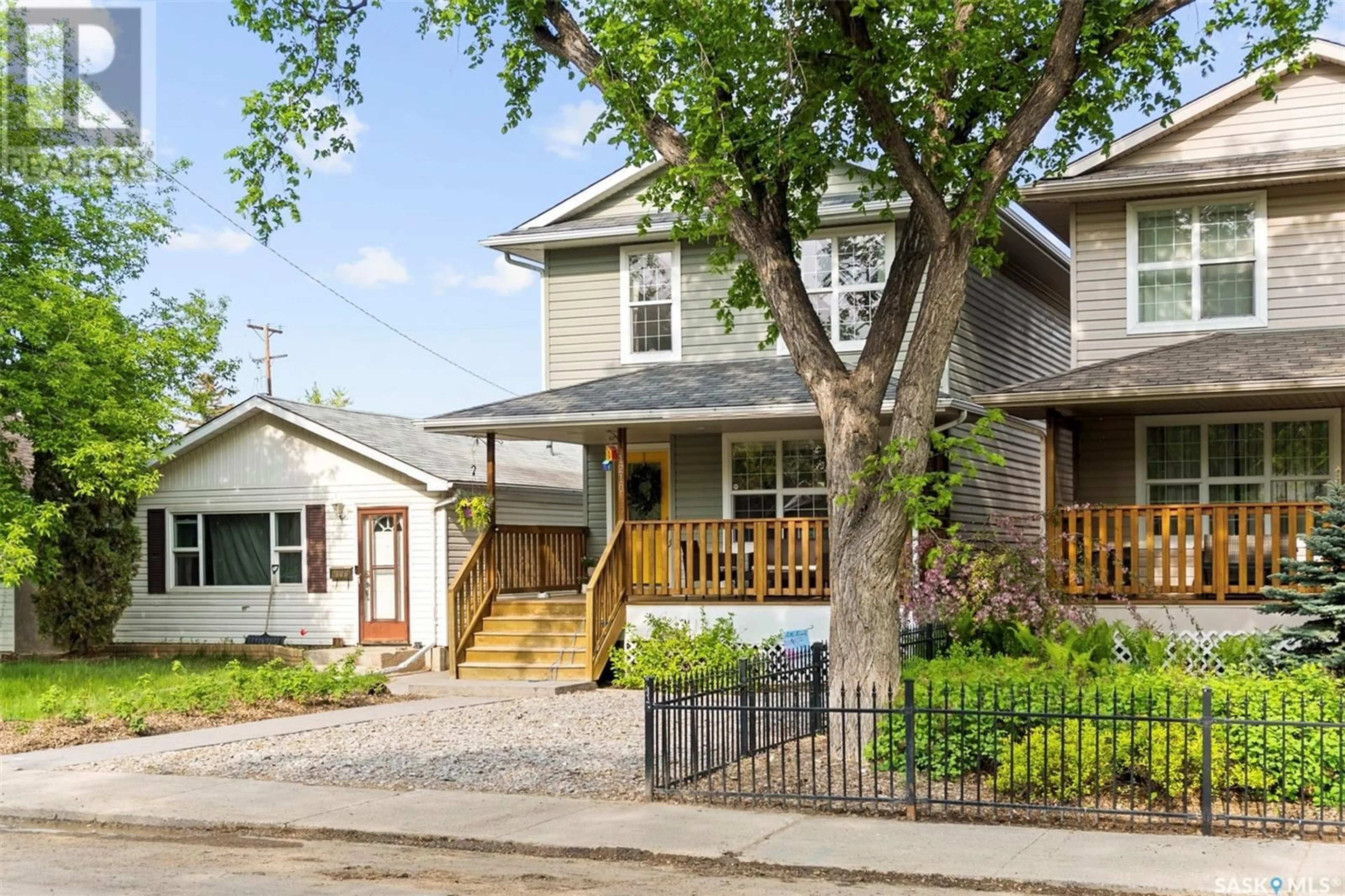 Home with vinyl exterior material, street for 1210 6TH AVENUE, Saskatoon Saskatchewan S7K2T5