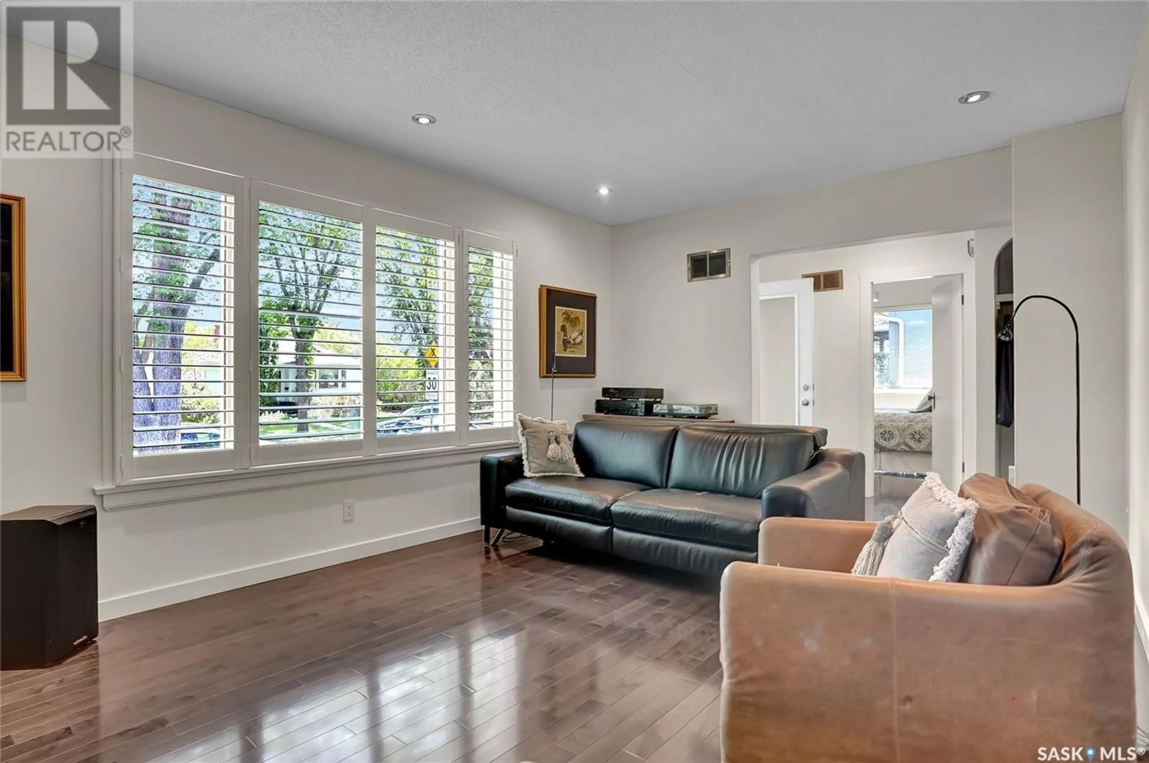 Living room with furniture, wood/laminate floor for 2860 ATHOL STREET, Regina Saskatchewan S4S1Y2