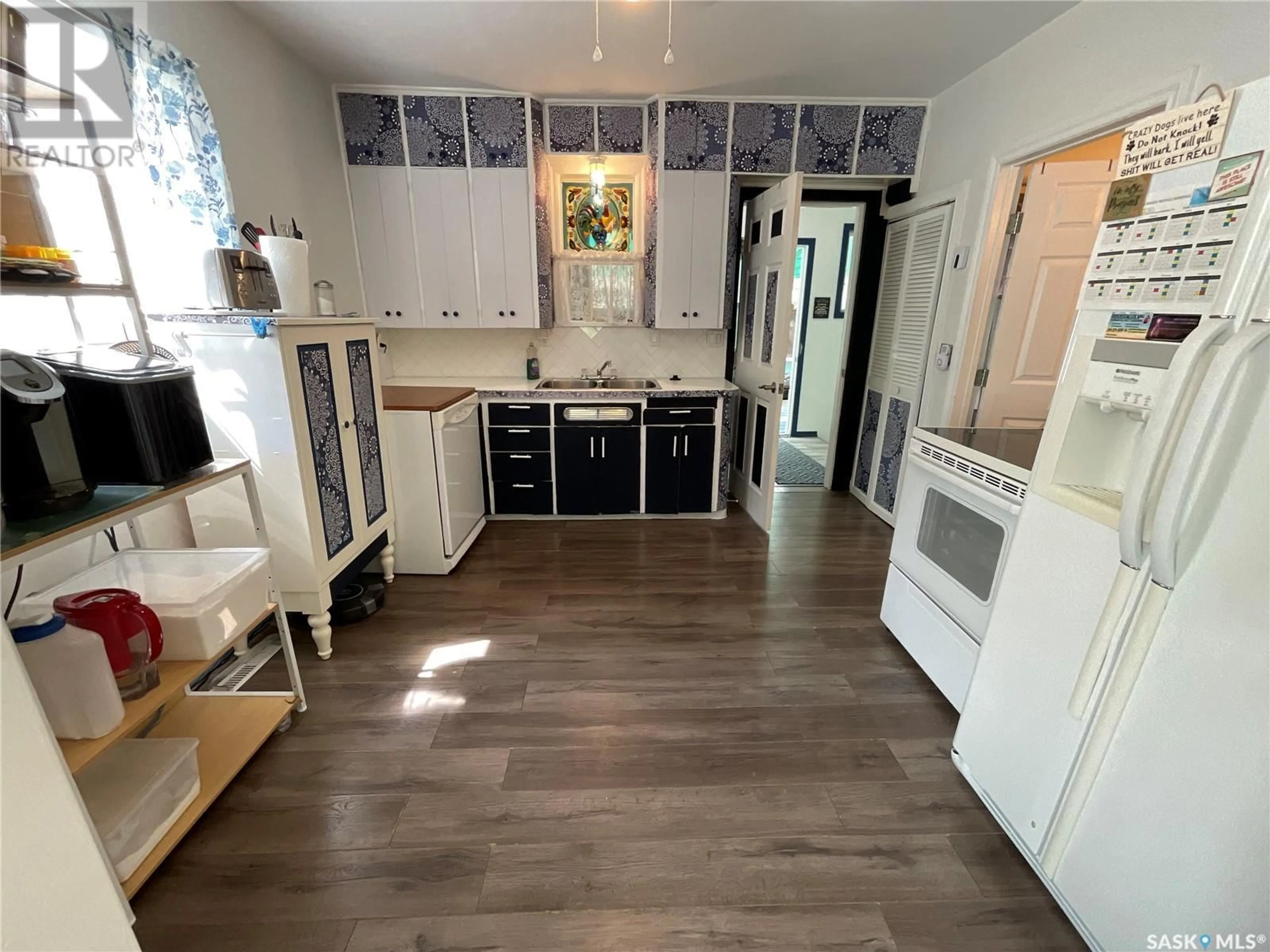 Kitchen with laundary machines, ceramic/tile floor for 213 1ST AVENUE, Blaine Lake Saskatchewan S0J0J0