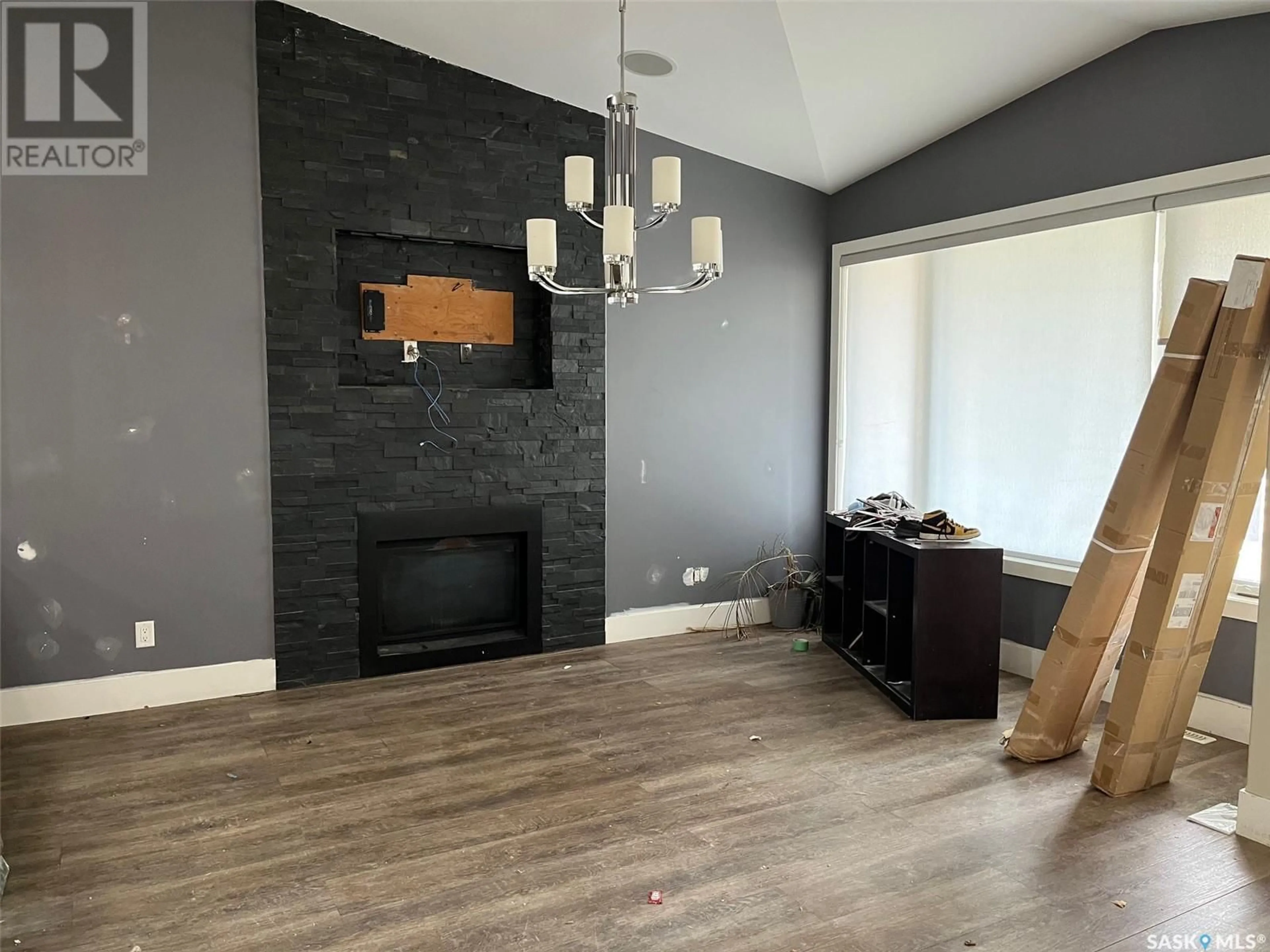 Living room with furniture, wood/laminate floor for 2431 JAMESON CRESCENT, Regina Saskatchewan S4V1K2