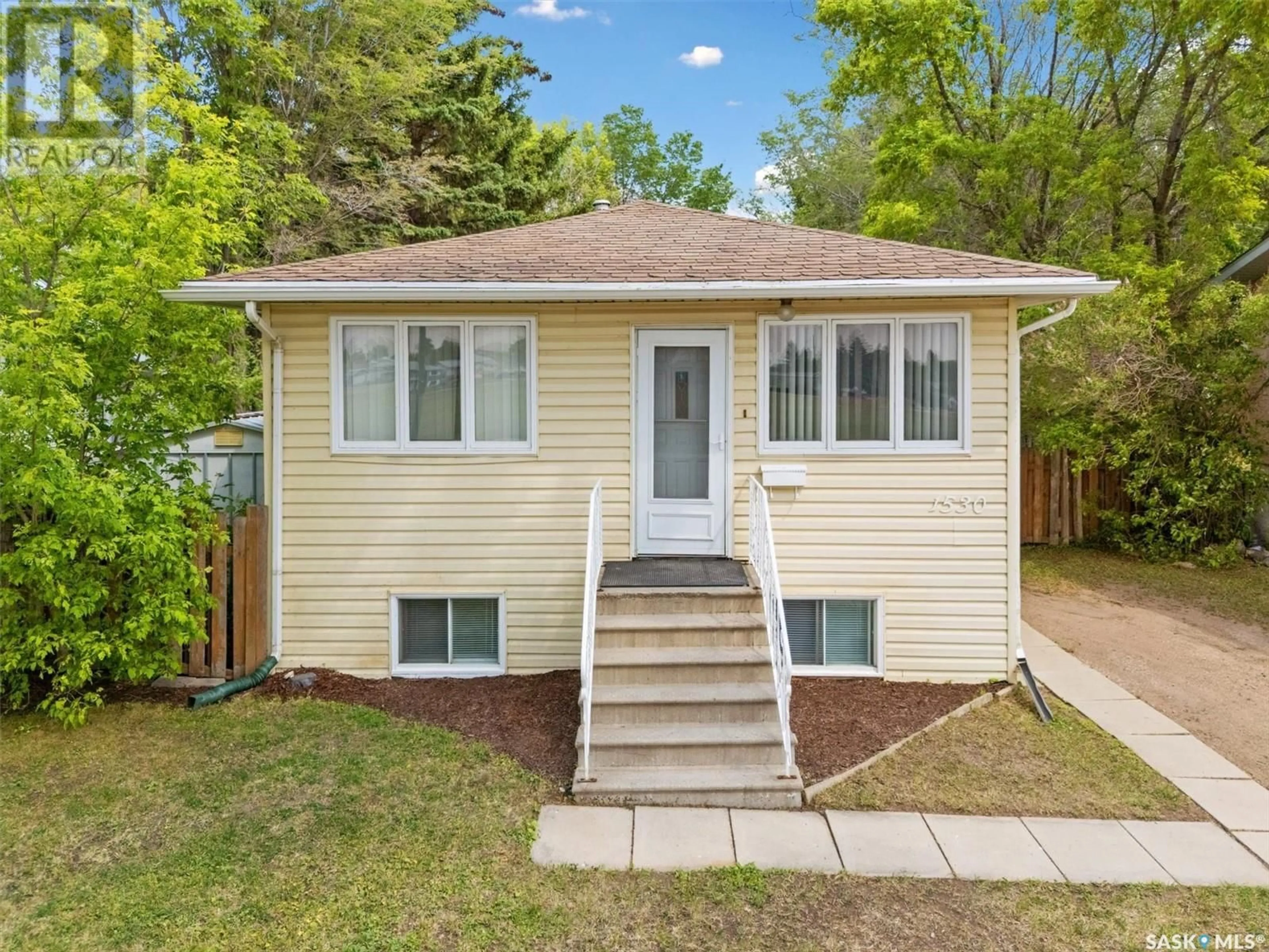 Home with vinyl exterior material, street for 1530 I AVENUE, Saskatoon Saskatchewan S7L2J6