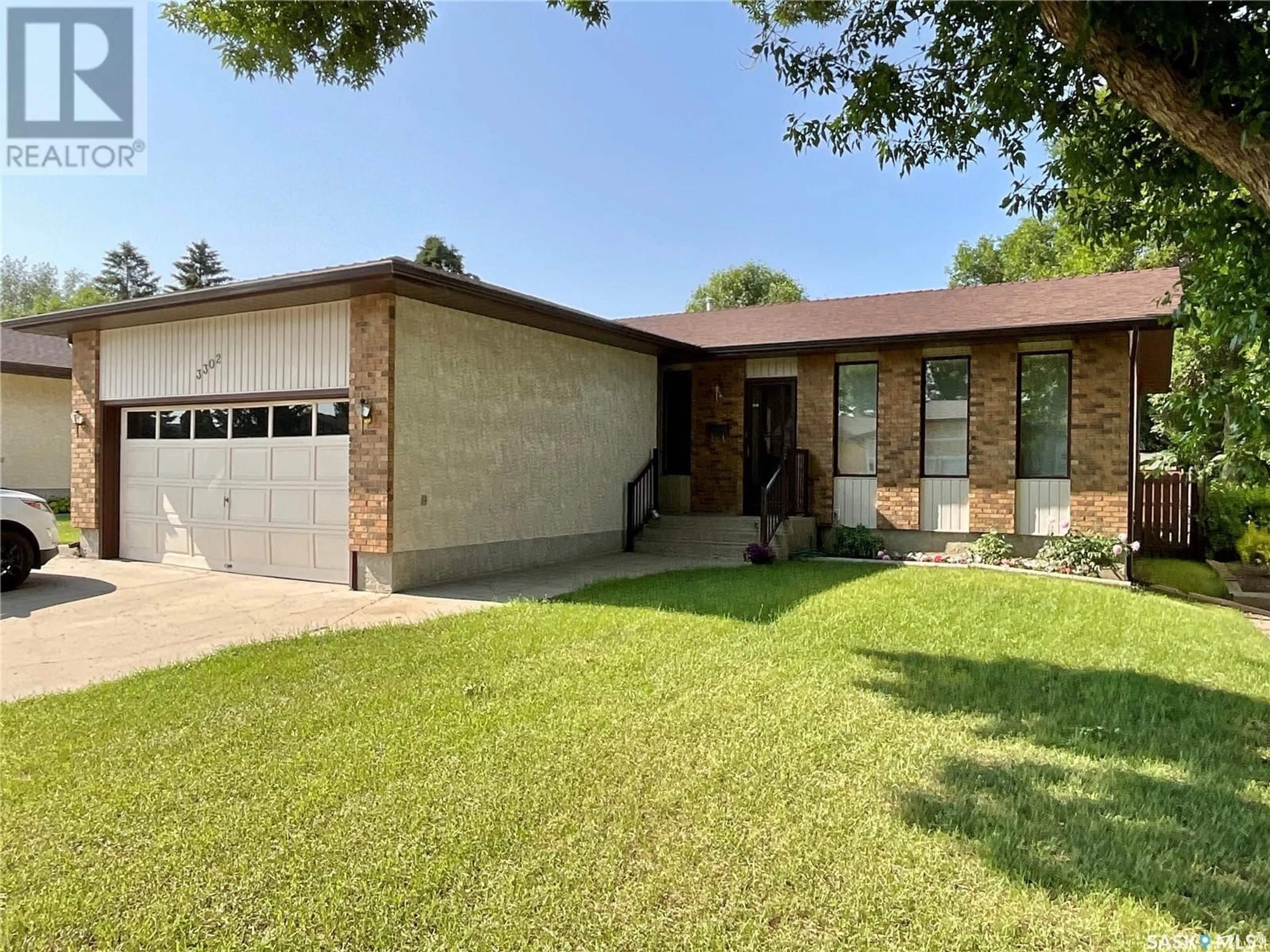 Home with brick exterior material, street for 3302 MACLACHLAN CRESCENT, Regina Saskatchewan S4R8H5