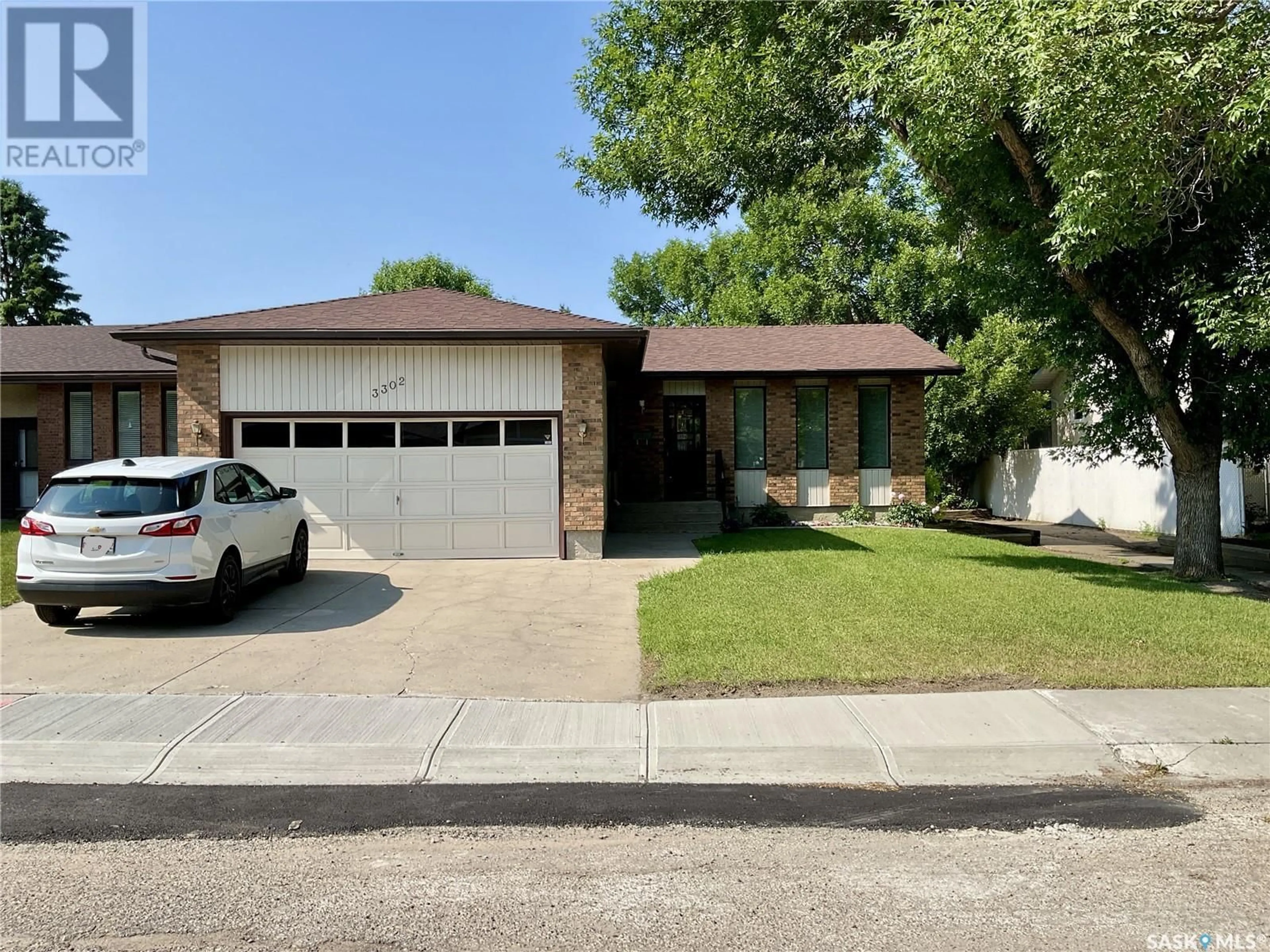 Home with brick exterior material, street for 3302 MACLACHLAN CRESCENT, Regina Saskatchewan S4R8H5