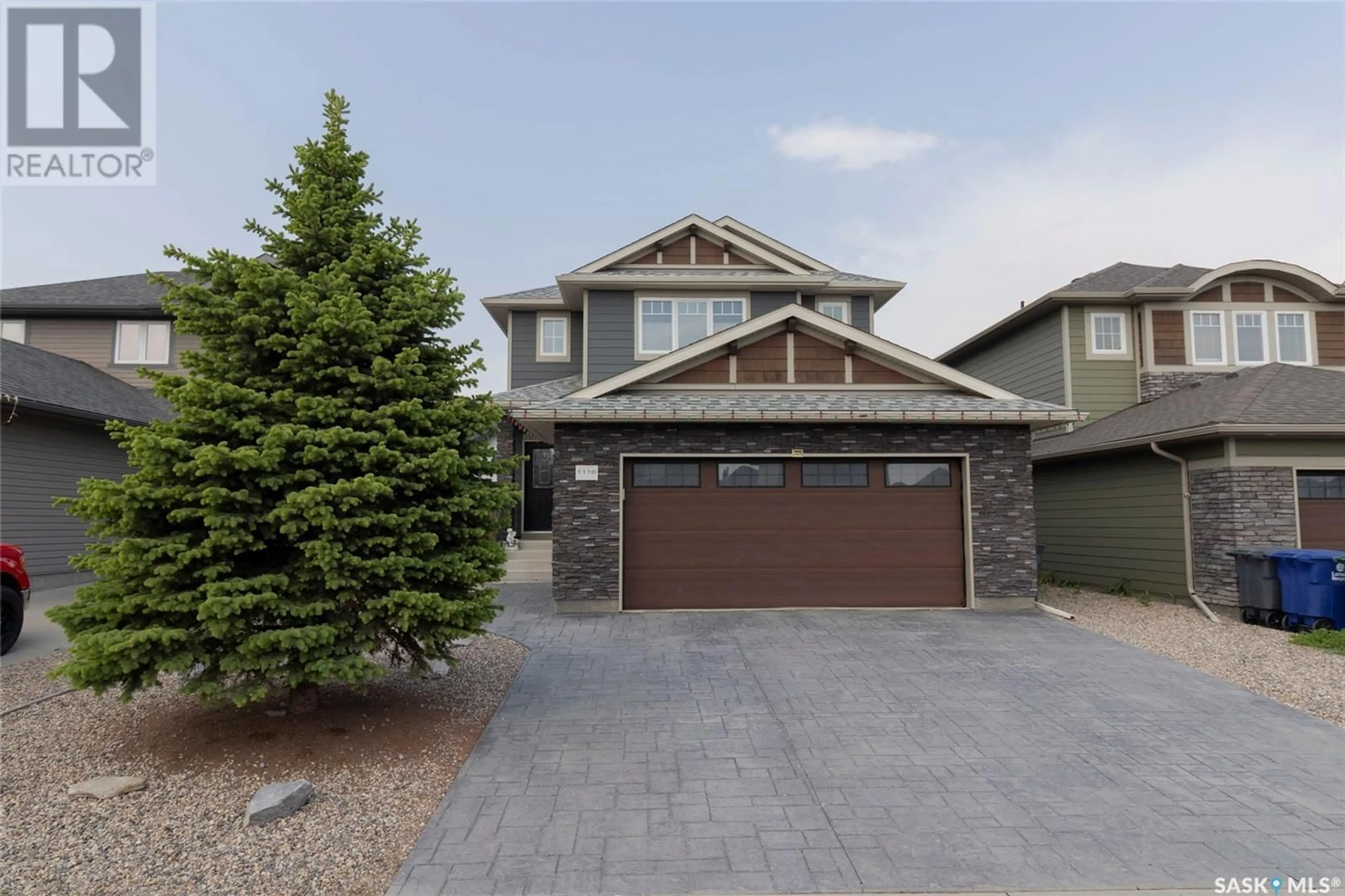 Home with vinyl exterior material, street for 1118 DENHAM RISE, Saskatoon Saskatchewan S7R0B2