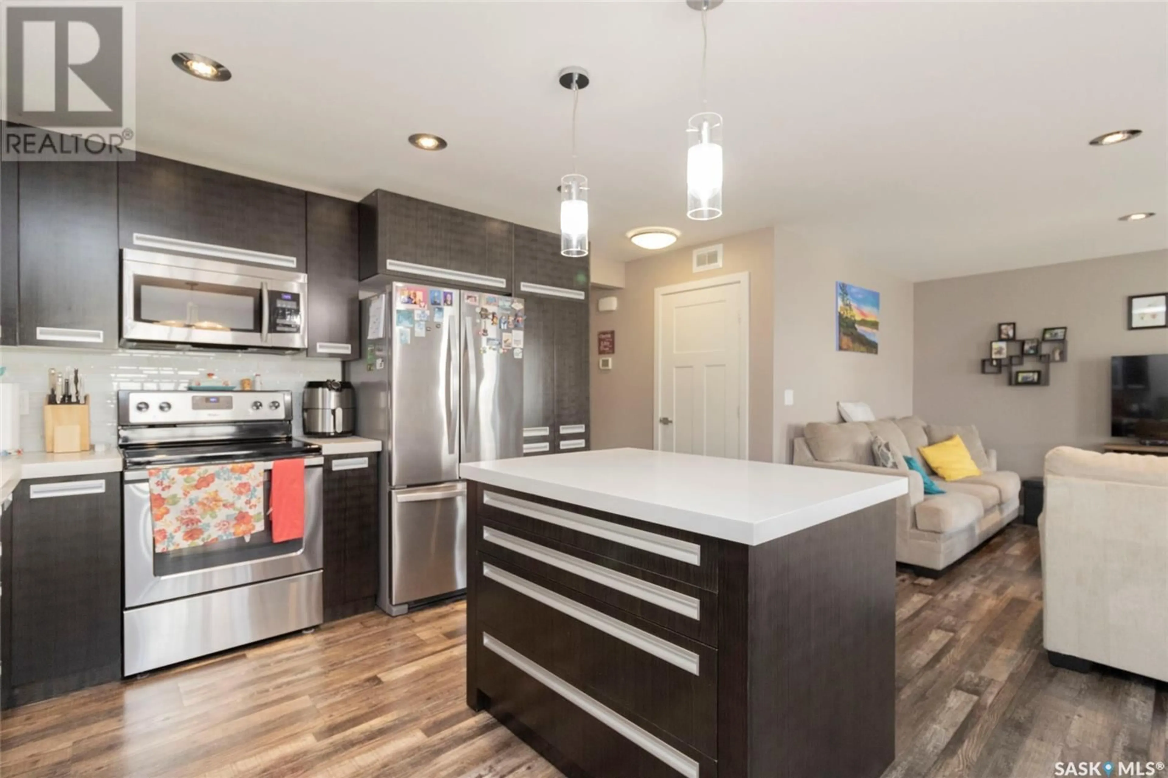 Open concept kitchen, wood/laminate floor for 1118 DENHAM RISE, Saskatoon Saskatchewan S7R0B2