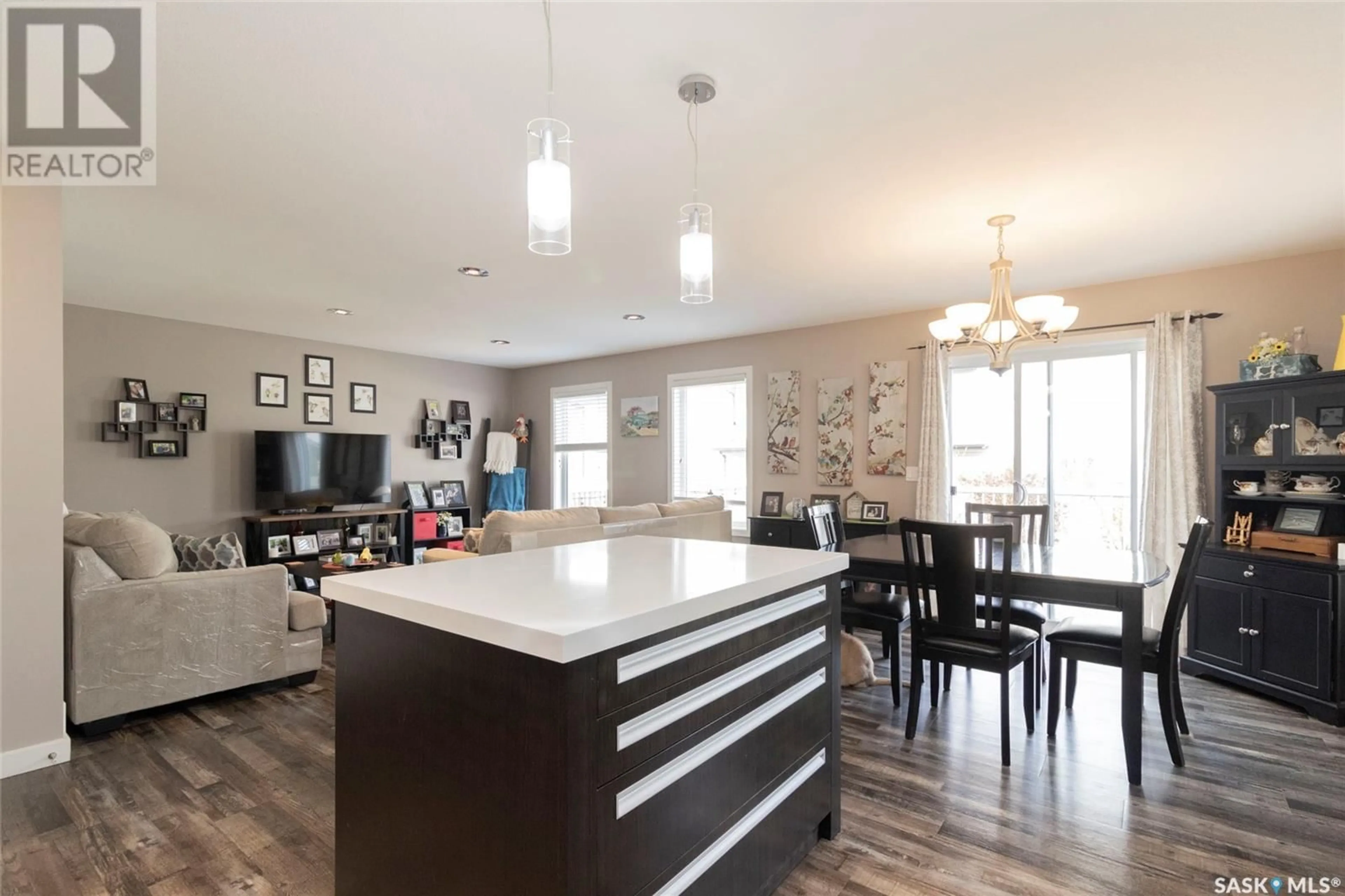 Open concept kitchen, wood/laminate floor for 1118 DENHAM RISE, Saskatoon Saskatchewan S7R0B2