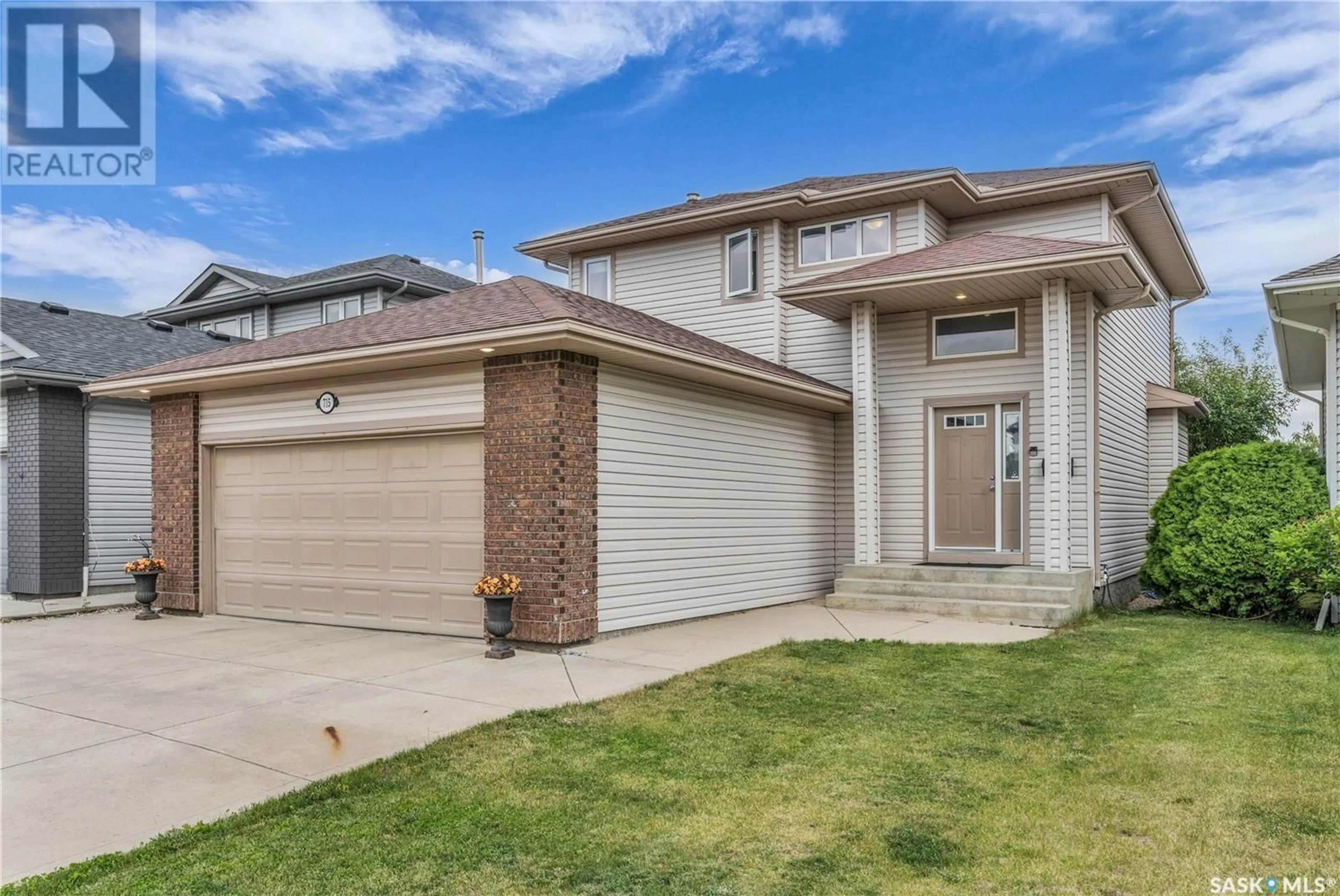Home with brick exterior material, street for 715 BUCKWOLD COVE, Saskatoon Saskatchewan S7N4V8