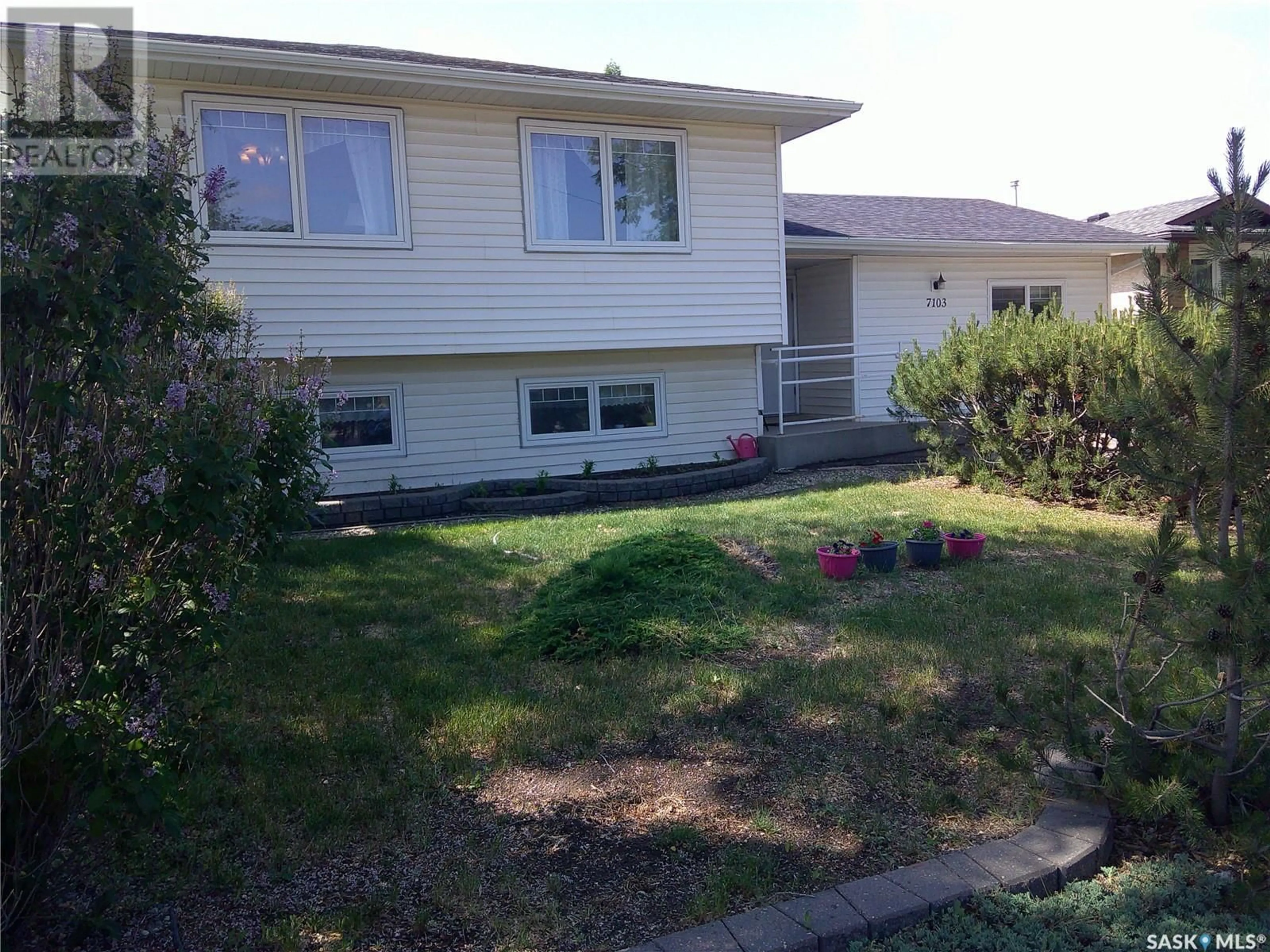 Home with vinyl exterior material, street for 7103 SHERWOOD DRIVE, Regina Saskatchewan S4X2V5