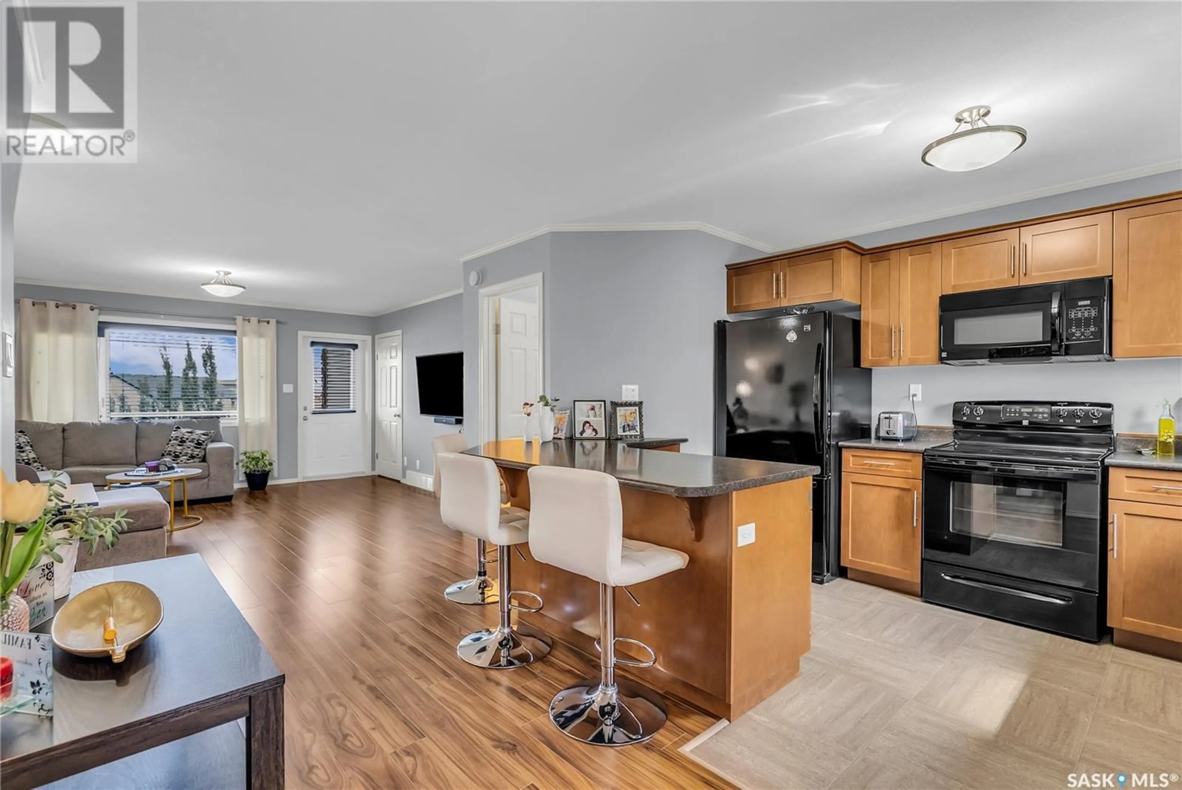 Open concept kitchen, wood/laminate floor for 310 - 1303 RICHARDSON ROAD, Saskatoon Saskatchewan S7R0L1