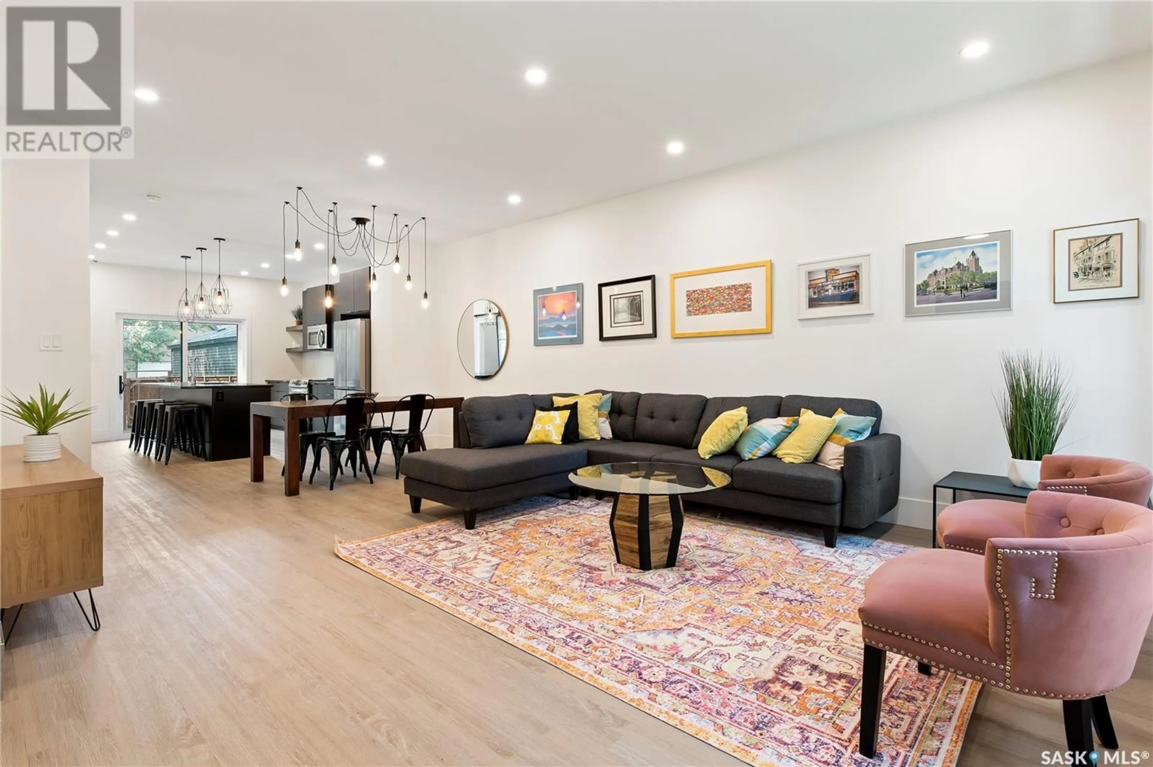 Living room with furniture, wood/laminate floor for 2460 LINDSAY STREET, Regina Saskatchewan S4N3C6