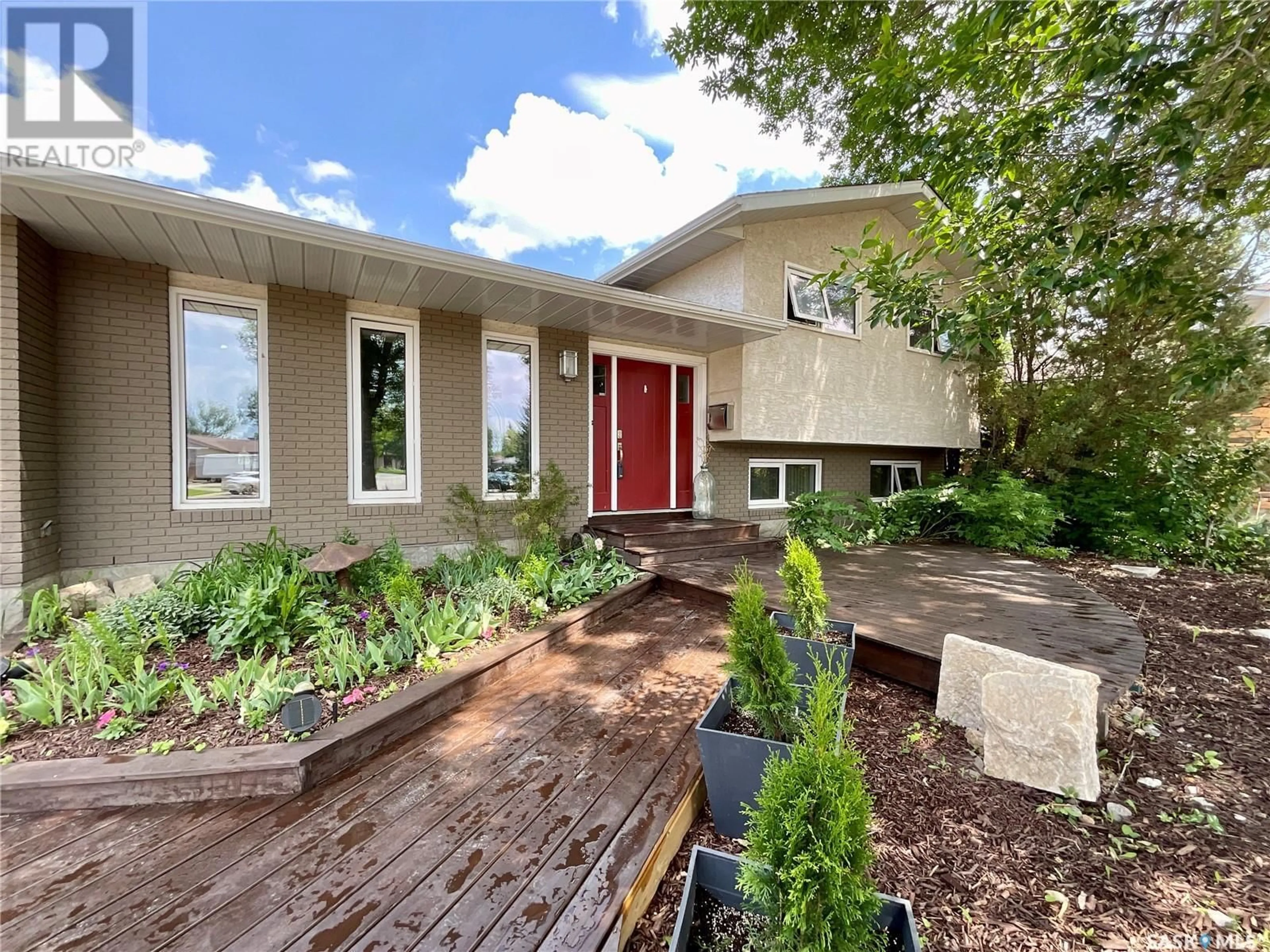 Home with brick exterior material, street for 118 HAWKES BAY, Regina Saskatchewan S4X1G7