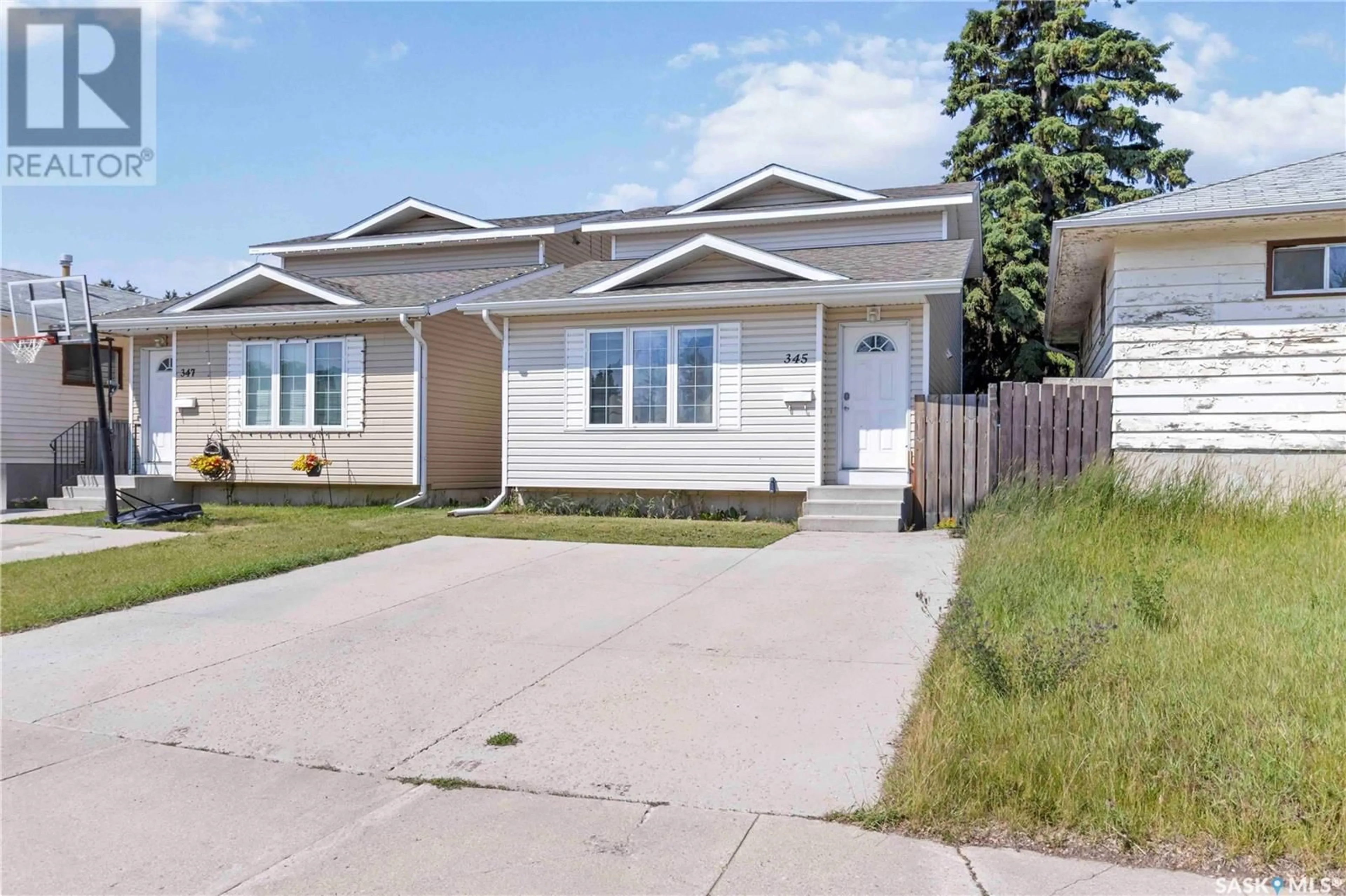 Home with vinyl exterior material, street for 345 X AVENUE, Saskatoon Saskatchewan S7M3H5