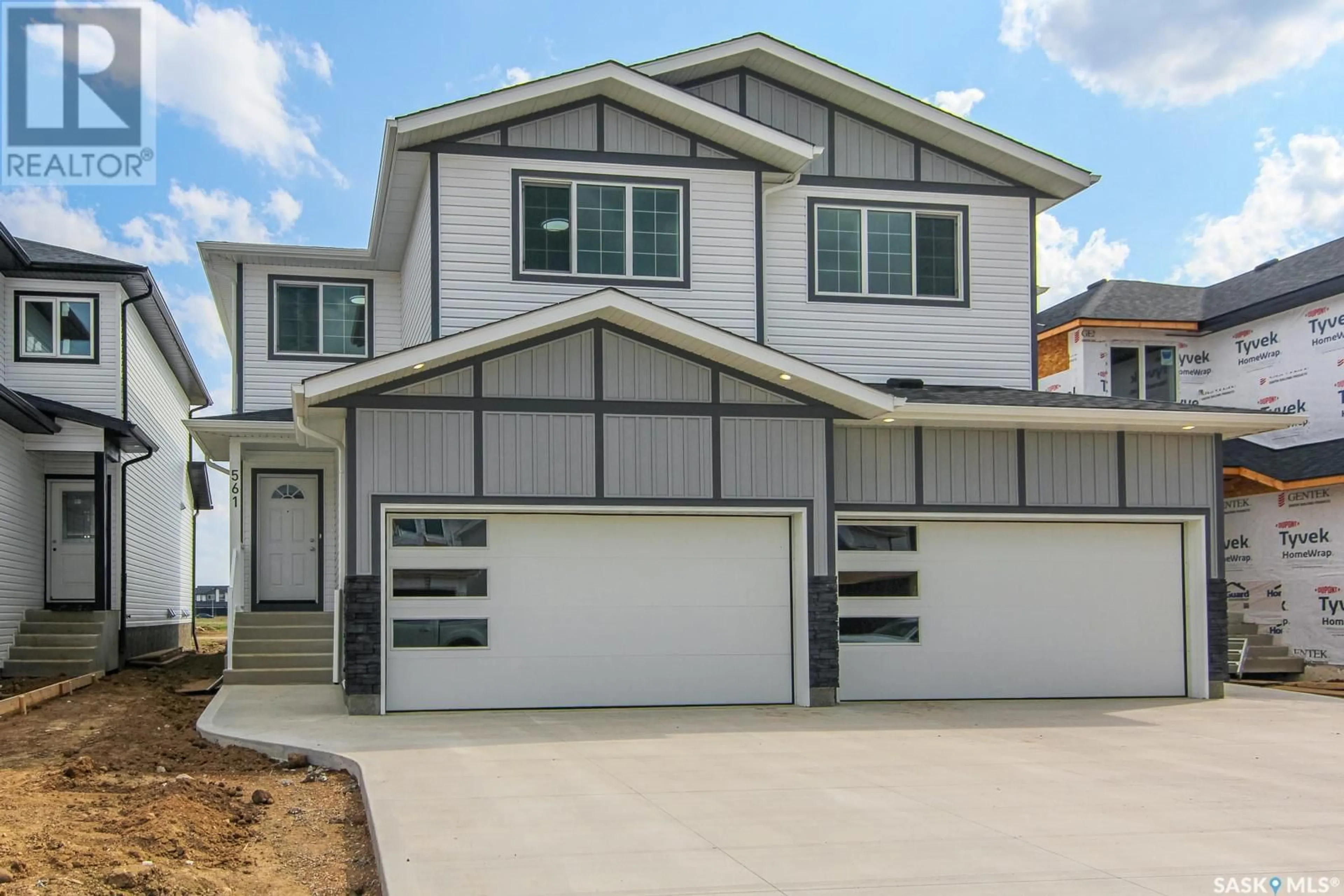 Home with vinyl exterior material, street for 555 SHARMA CRESCENT, Saskatoon Saskatchewan S7W1K6