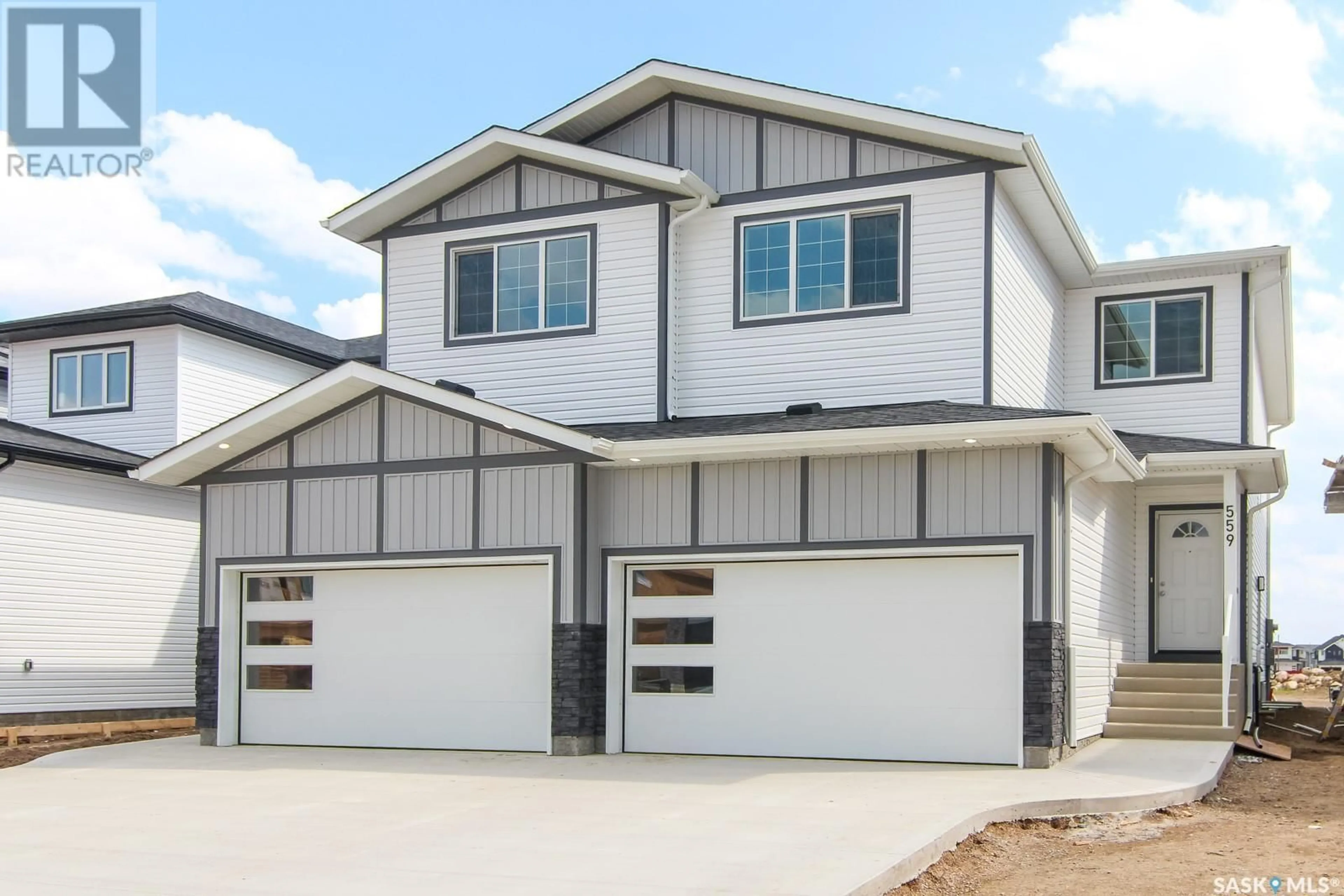 Home with vinyl exterior material, street for 555 SHARMA CRESCENT, Saskatoon Saskatchewan S7W1K6