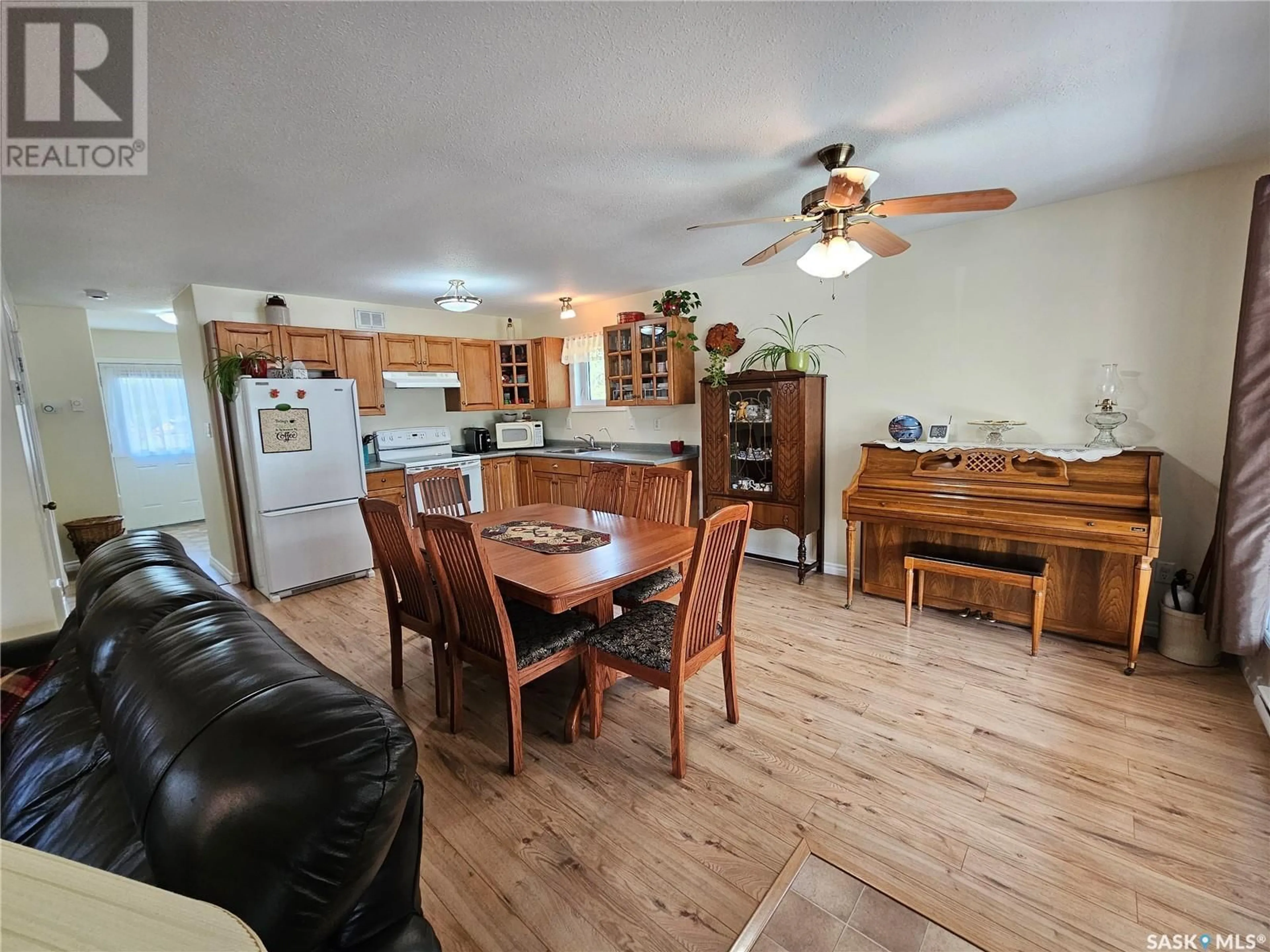 Open concept kitchen, wood/laminate floor for 109 ASPEN DRIVE, Meadow Lake Rm No.588 Saskatchewan S0M0T0