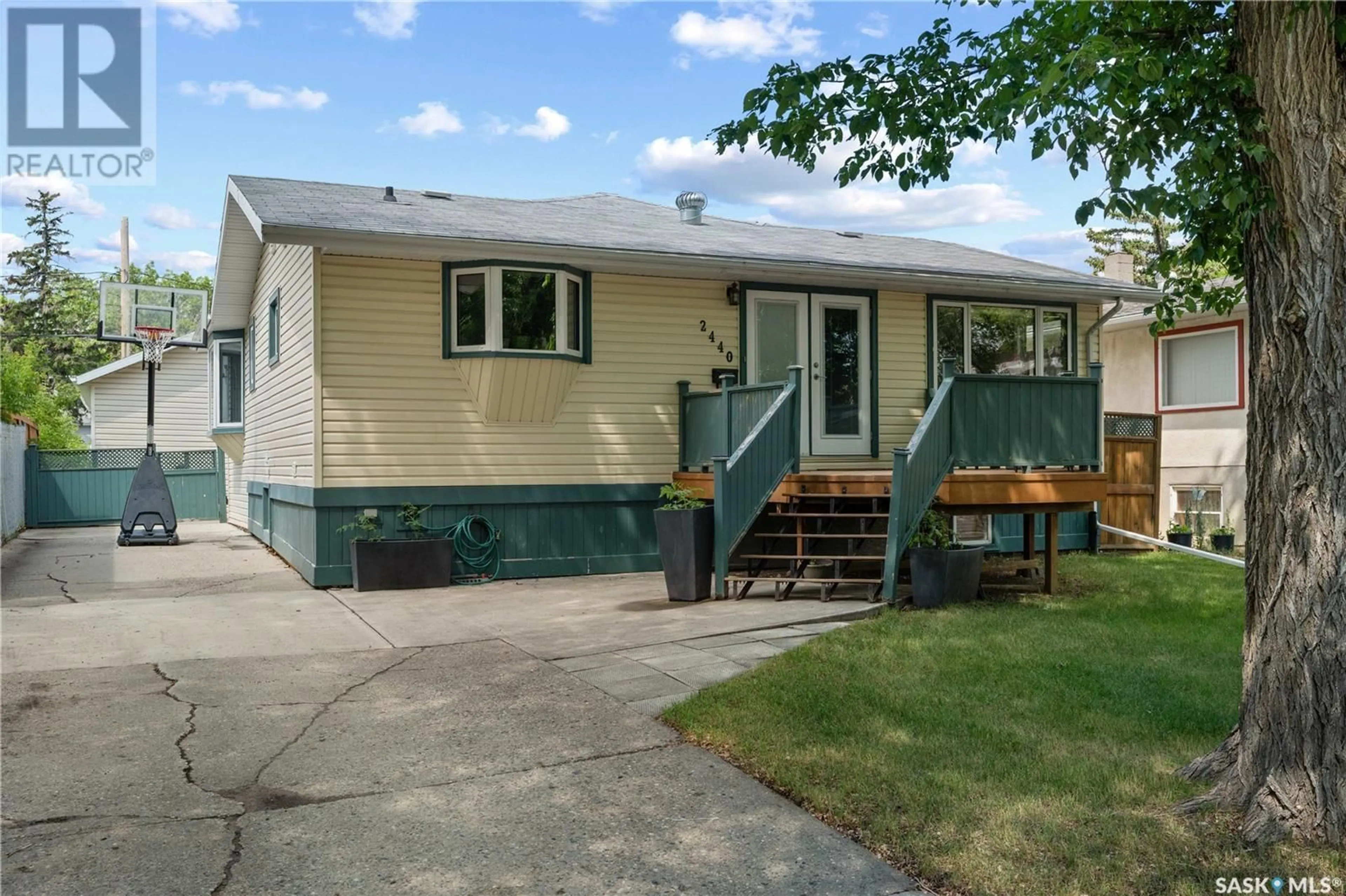 Home with vinyl exterior material, street for 2440 FRANCIS STREET, Regina Saskatchewan S4N2P9