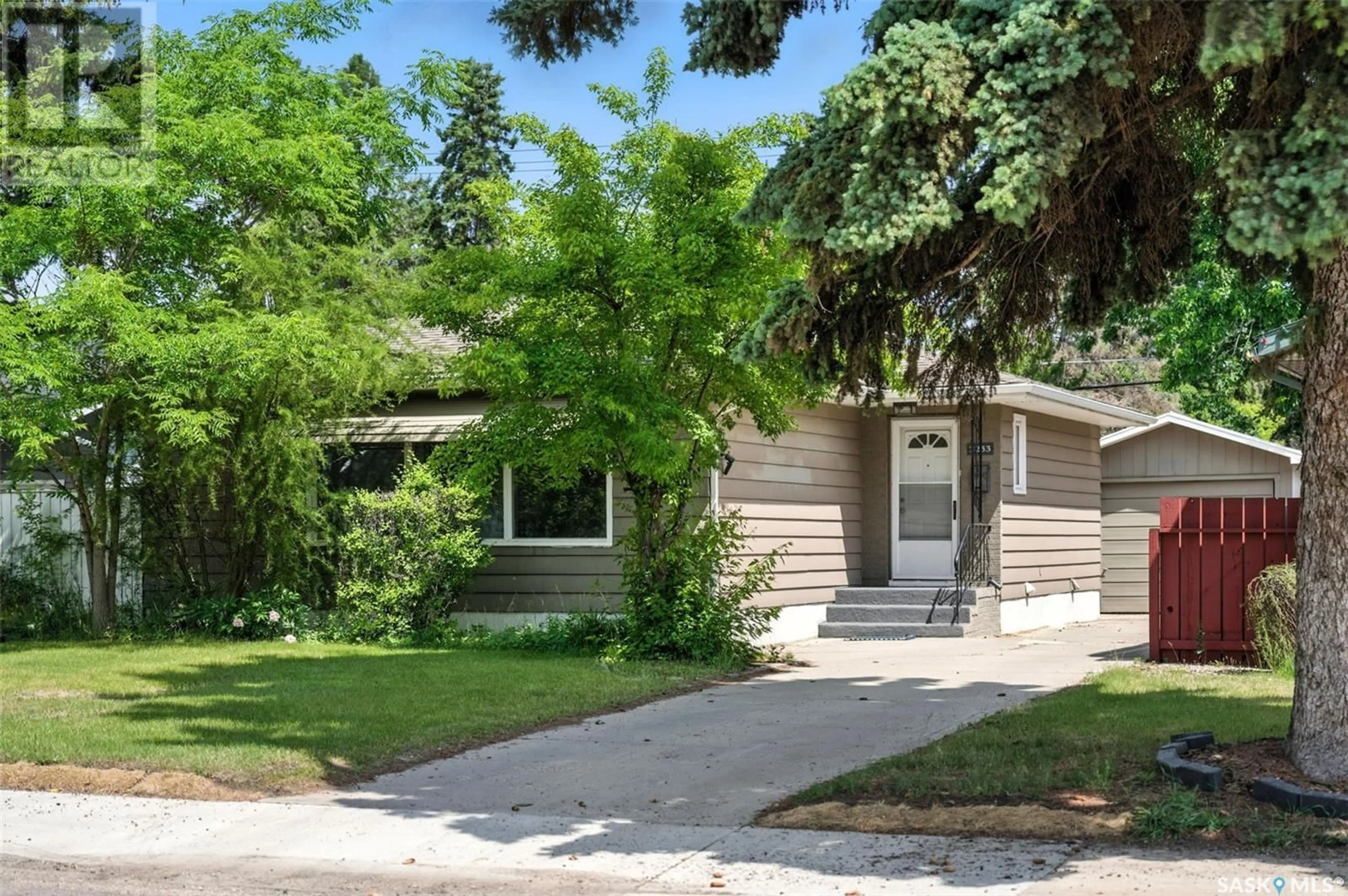 Home with vinyl exterior material, street for S - 2233 CUMBERLAND AVENUE, Saskatoon Saskatchewan S7J1Z4
