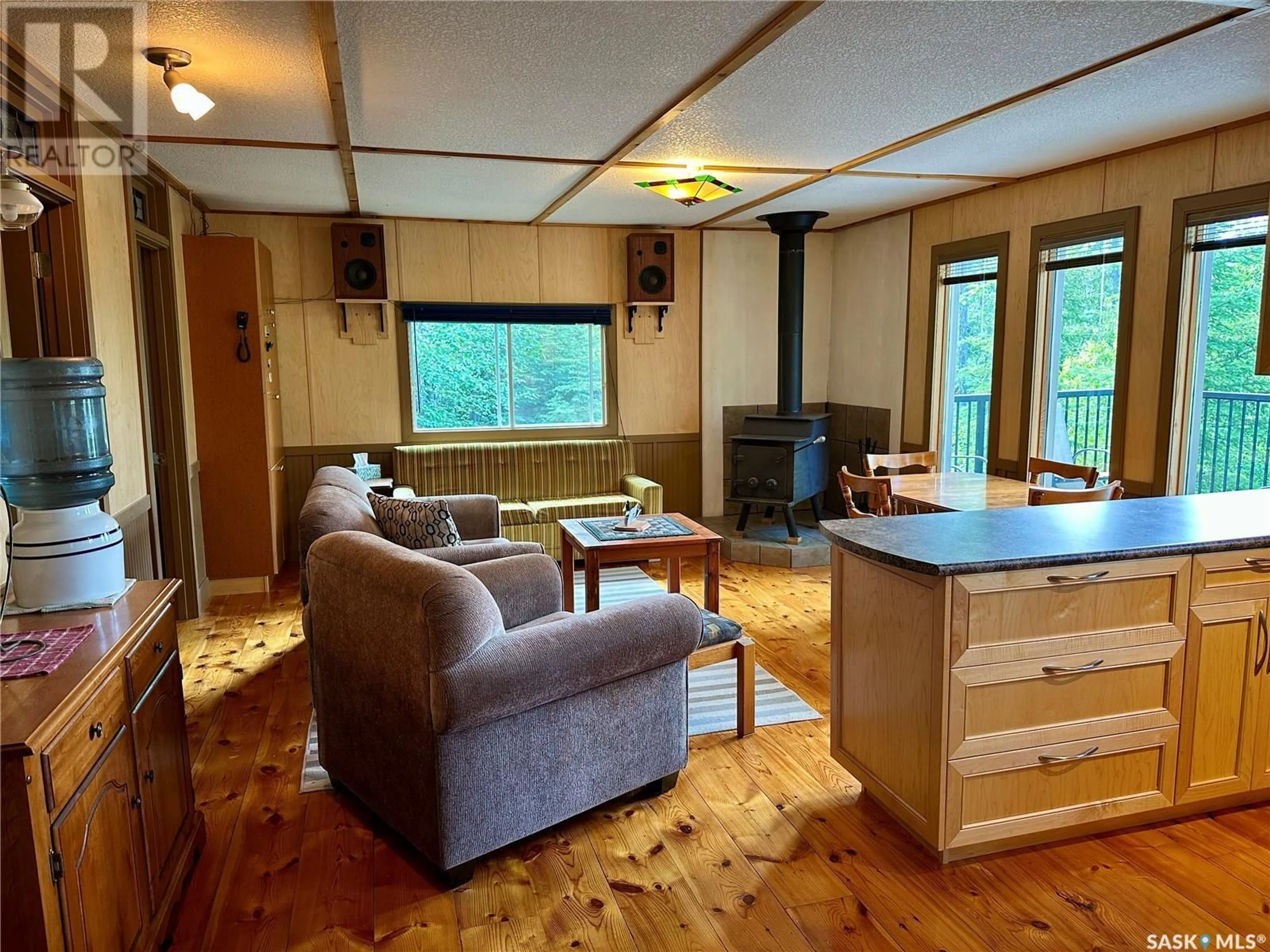 Living room with furniture, wood/laminate floor for REMOTE CABIN, Lac La Ronge Provincial Park Saskatchewan S0J1L0