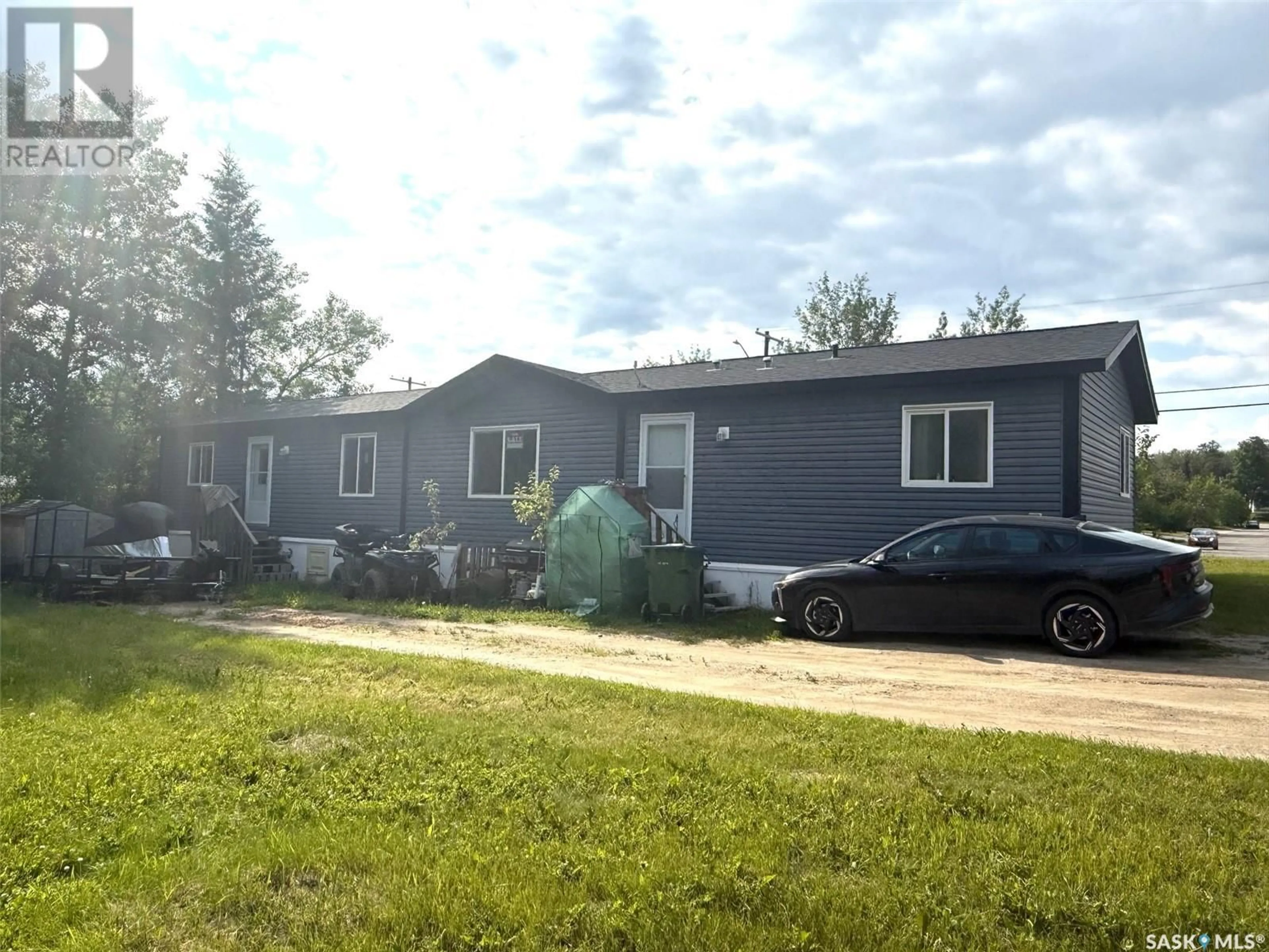 Home with vinyl exterior material, street for 17 - 1703 BEDFORD DRIVE, La Ronge Saskatchewan S0J1L0