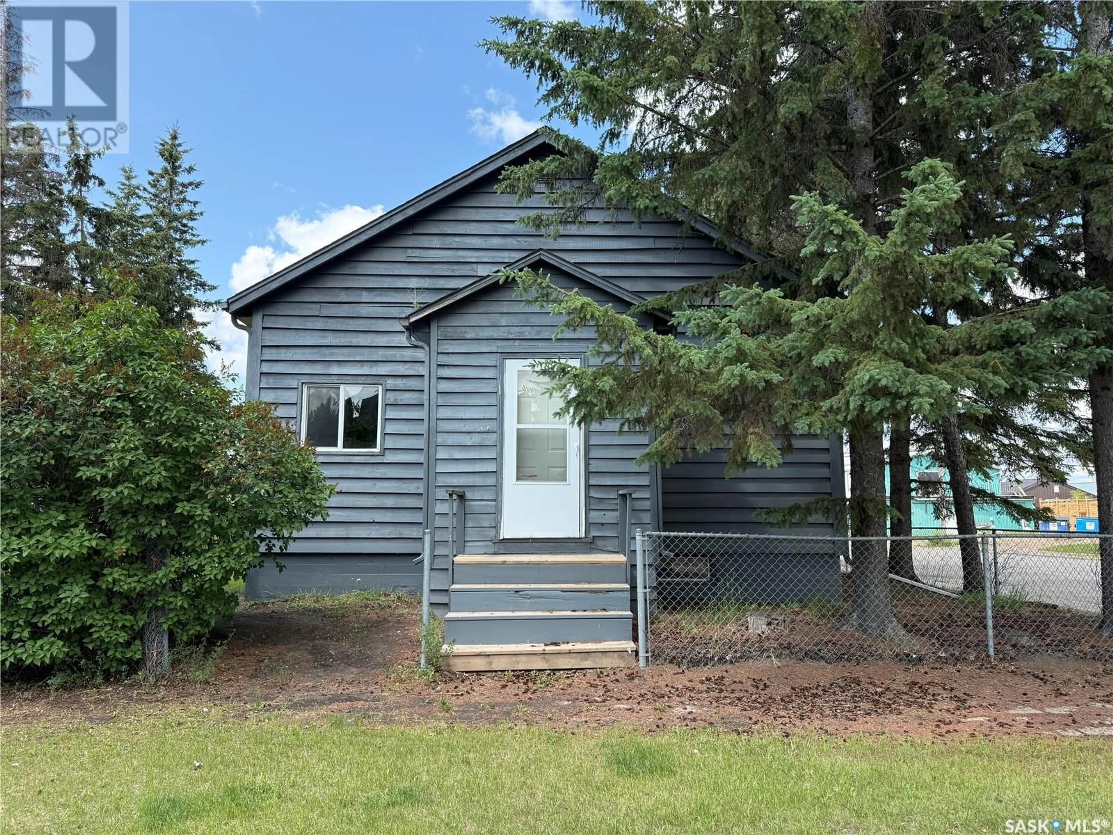 Home with vinyl exterior material, street for 303 1ST STREET, Meadow Lake Saskatchewan S9X1E7