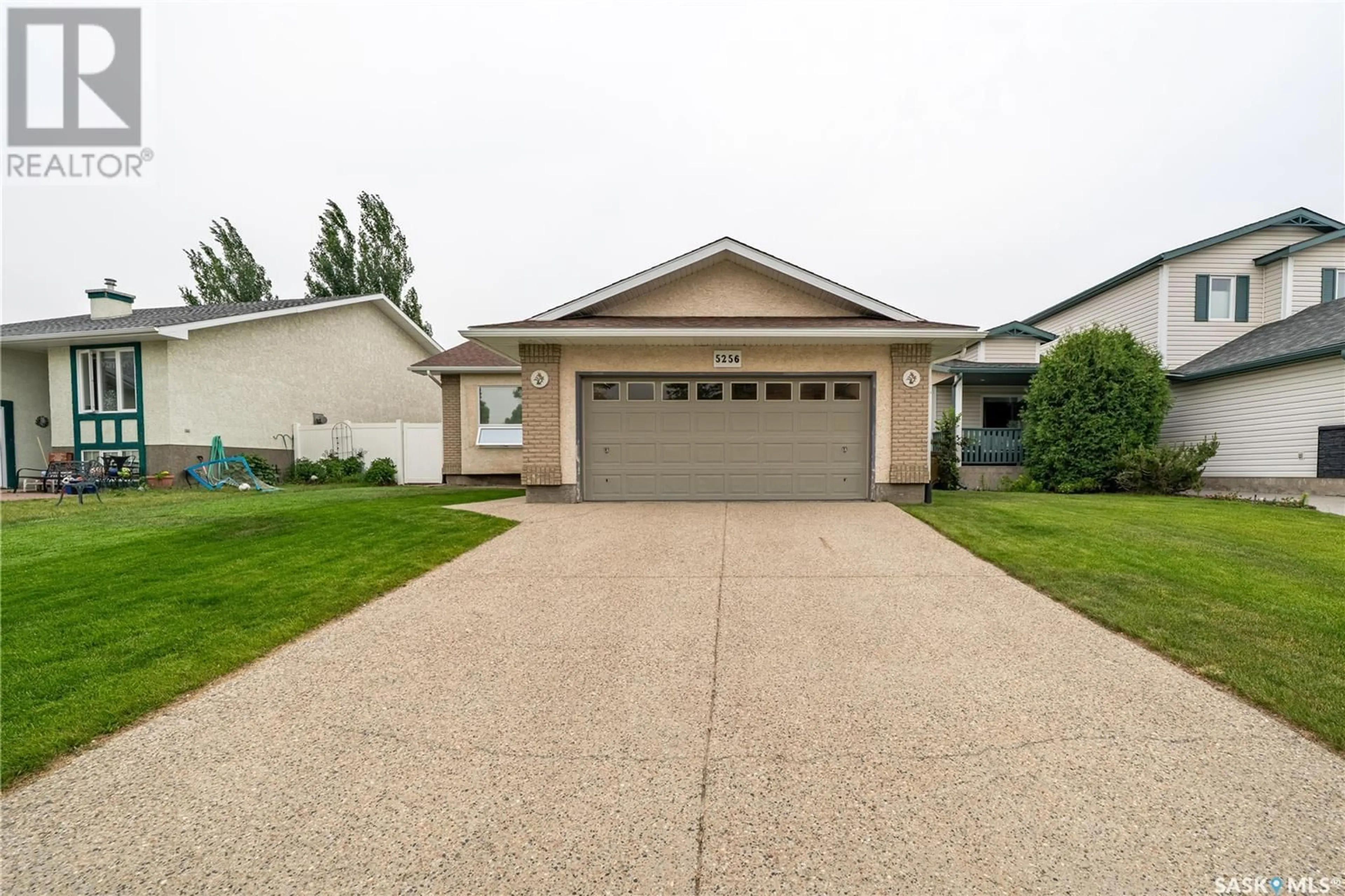 Home with vinyl exterior material, street for 5256 STAFF CRESCENT, Regina Saskatchewan S4X4M2