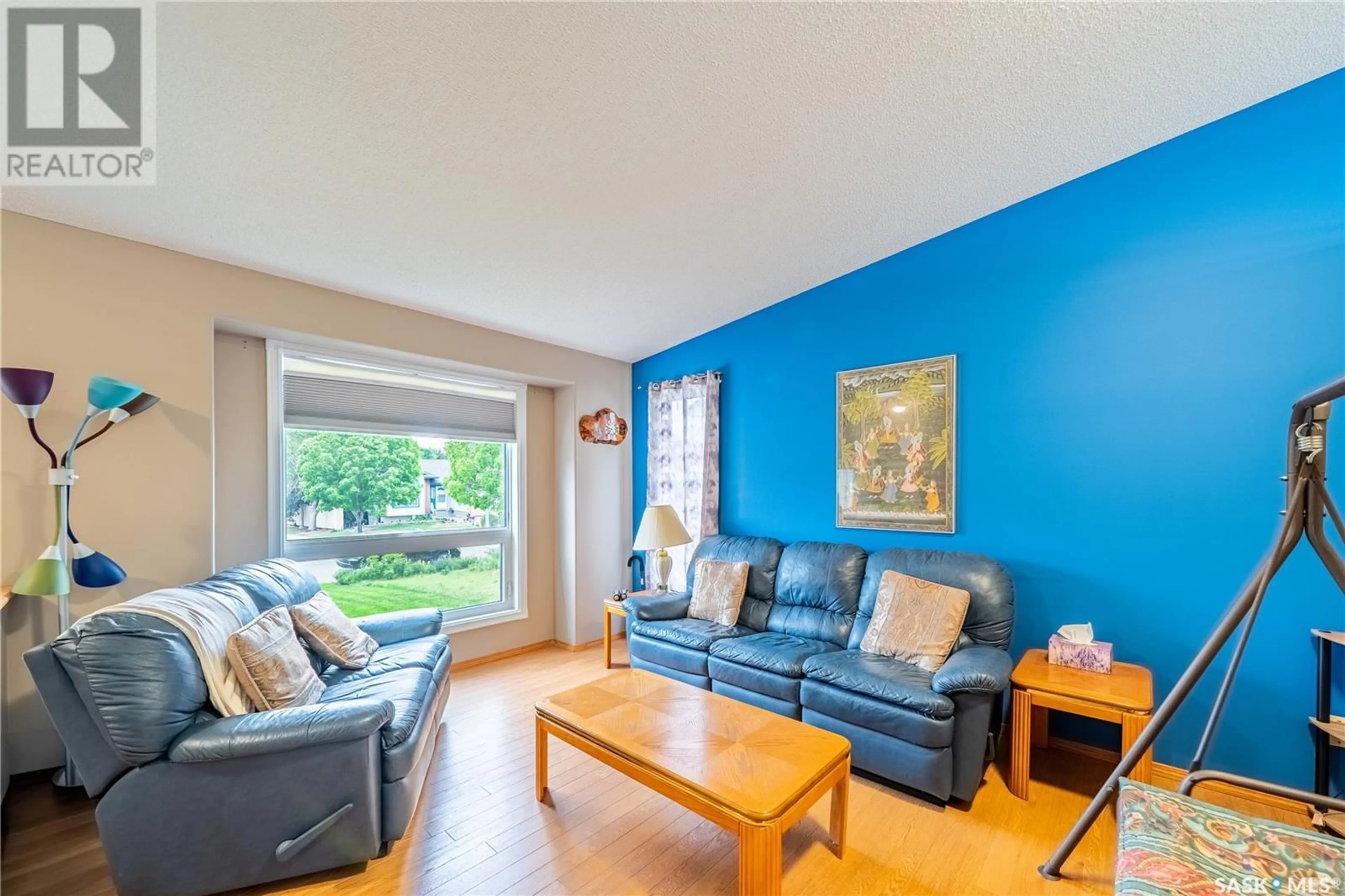 Living room with furniture, wood/laminate floor for 5256 STAFF CRESCENT, Regina Saskatchewan S4X4M2
